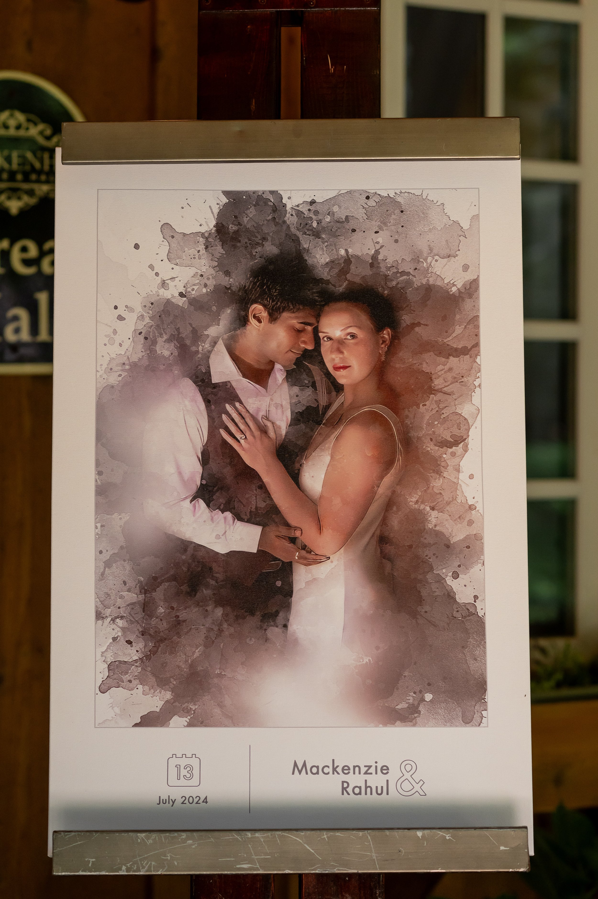 Watercolor-style wedding date card for Mackenzie and Rahul with a romantic couple portrait and July 2024 date.