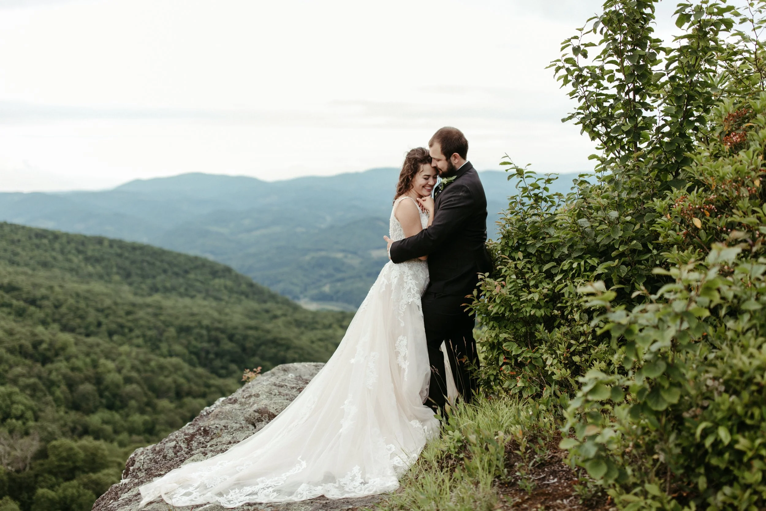 bride-groom-mountain-overlook-cliffside-wedding-portrait.jpg