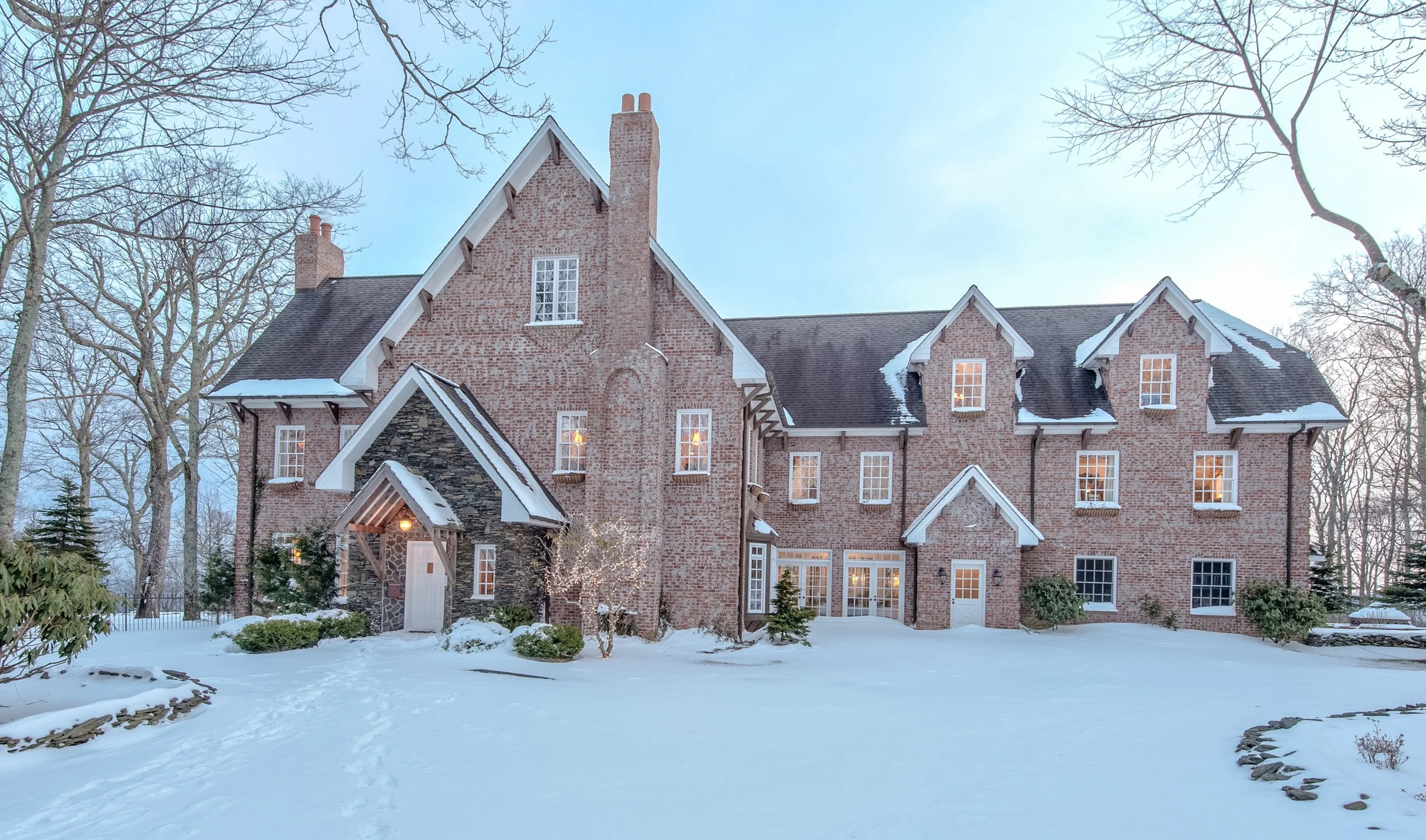 Brick estate wedding venue exterior covered in snow during winter