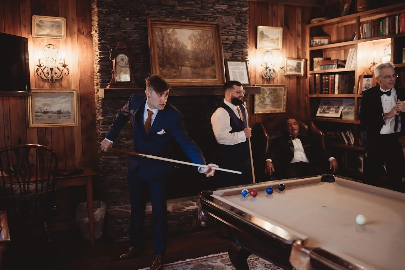 4 men people playing pool