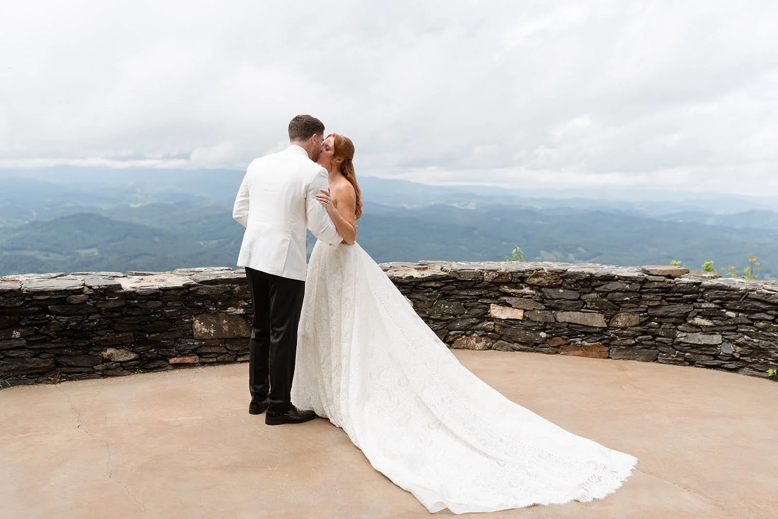 bride-and-groom-kissing-at-blue-ridge-mountain-overlook.jpg