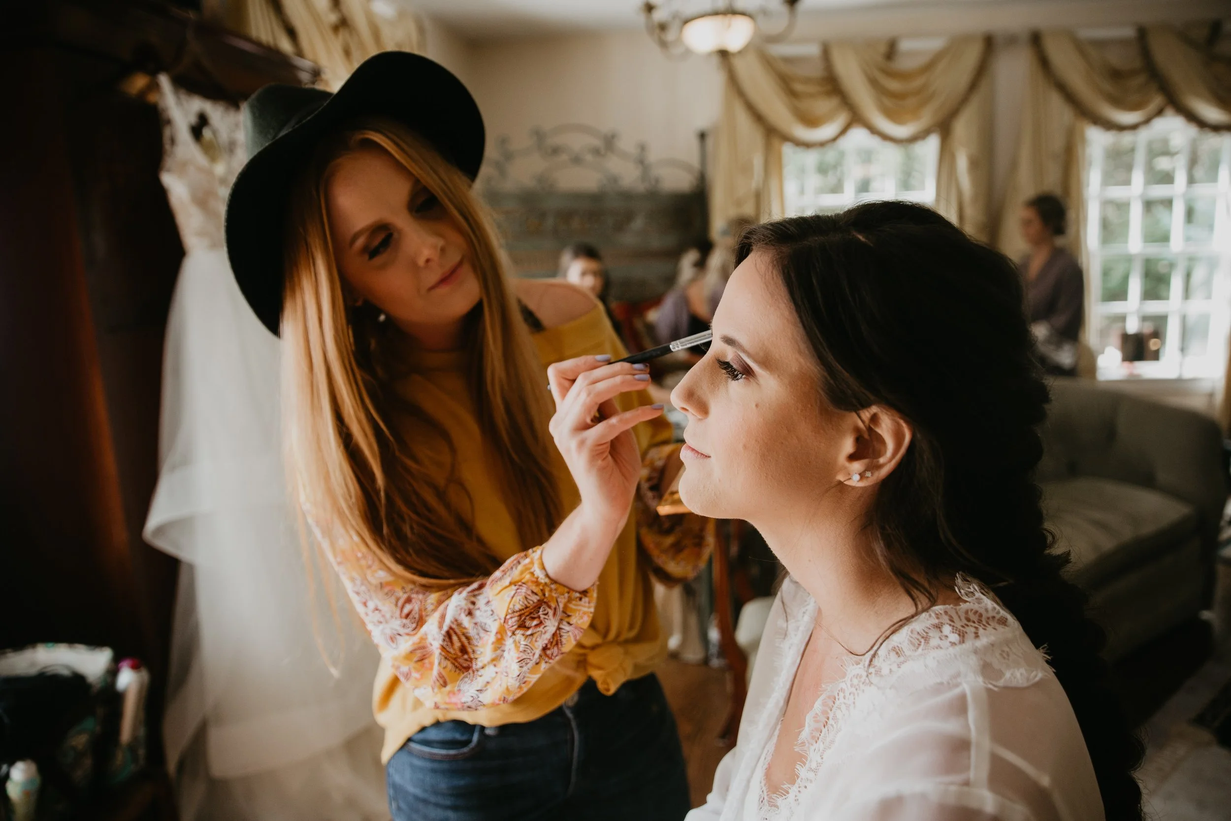 bride-getting-ready-makeup-artist-application