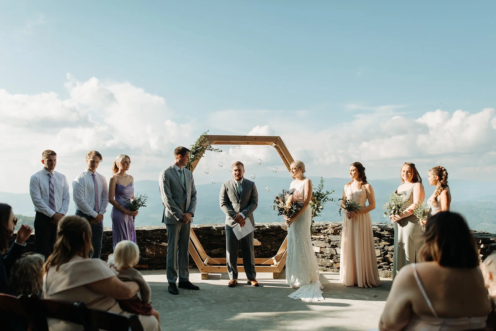 mountain-overlook-wedding-ceremony-with-hexagon-wood-arch.jpg