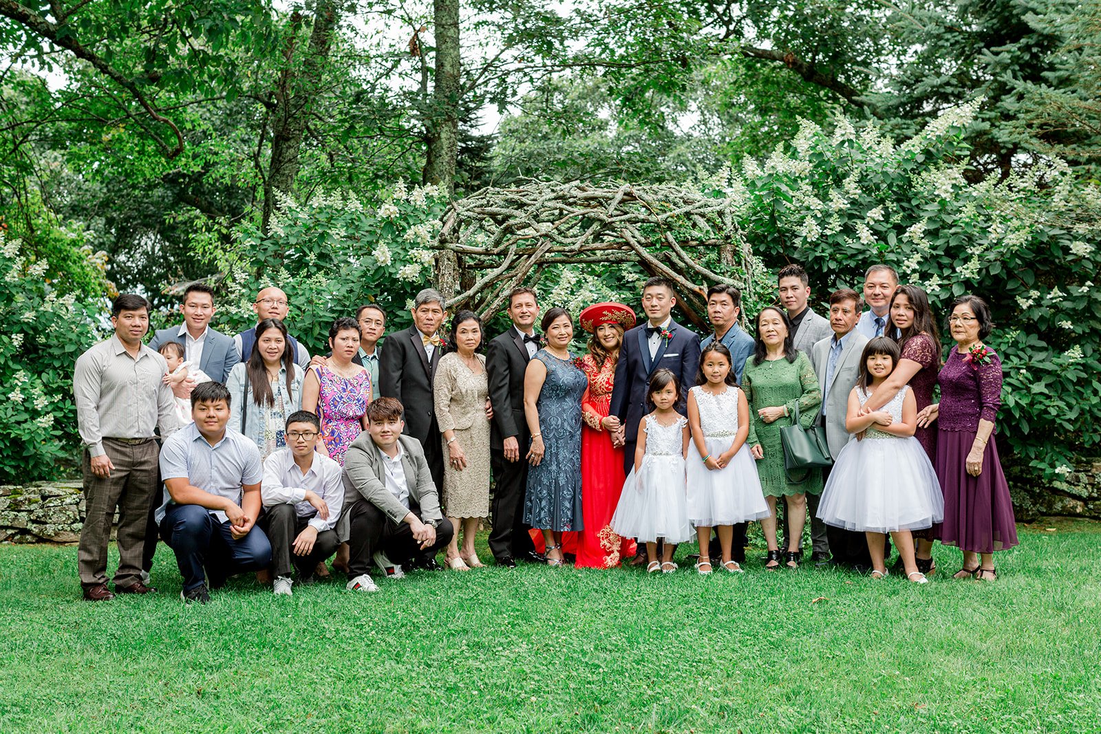 garden-family-wedding-portrait-under-branch-arch.jpg