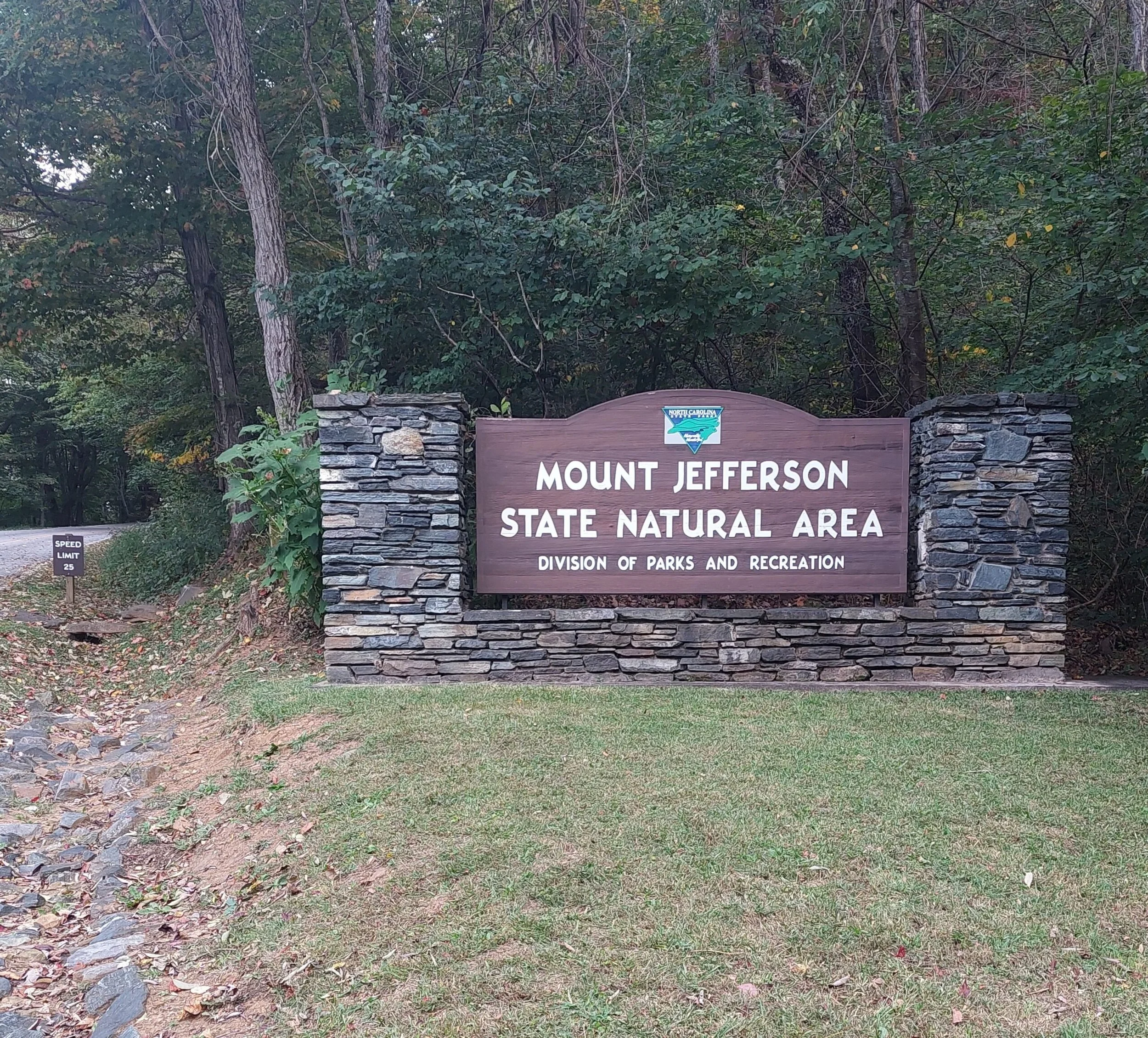 Mount Jefferson State Natural Area entrance sign made of stone and wood