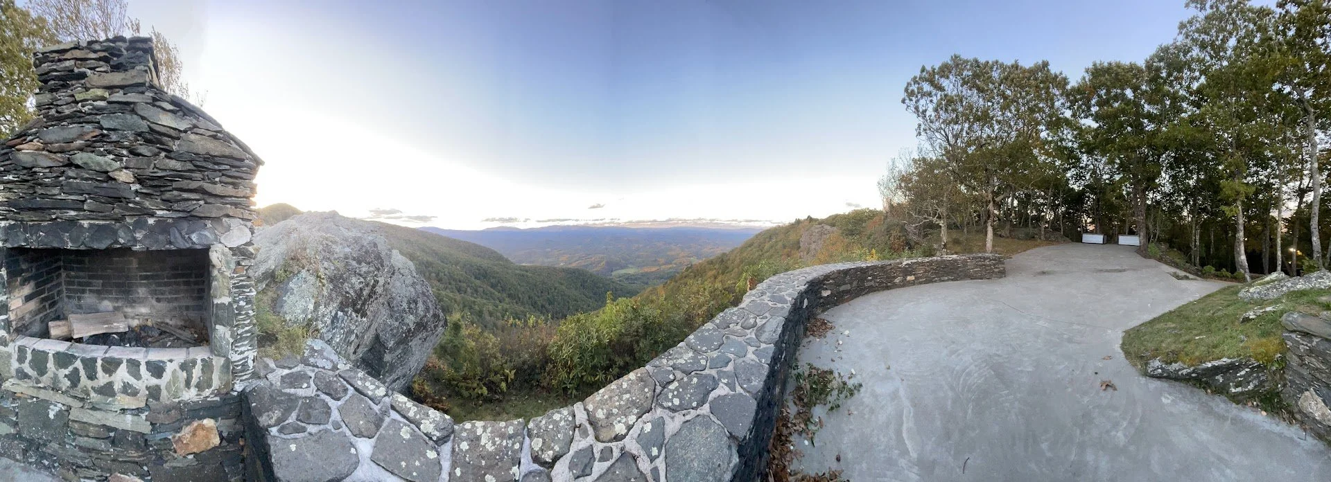 Panoramic view from a stone terrace mountain overlook with sweeping valley views