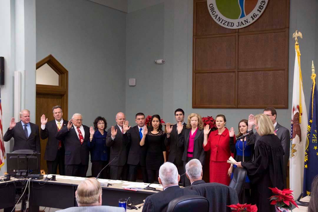 Newcomers and incumbents being sworn in by Sixteenth Circuit Chief Judge, Susan Clancy Boles.