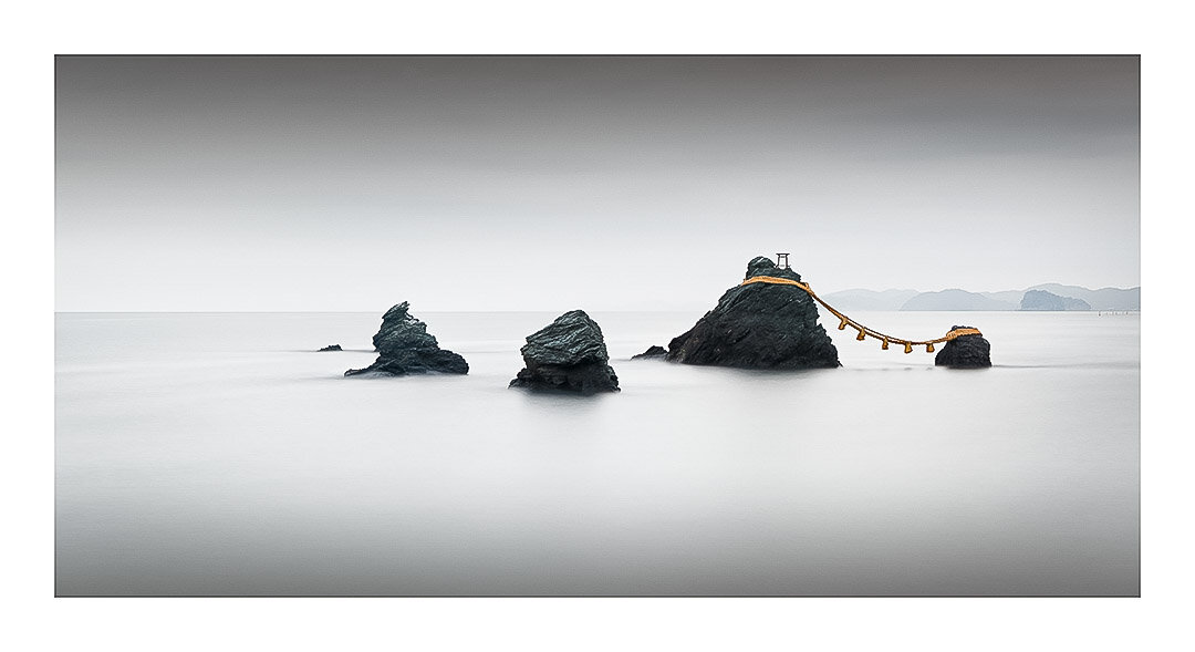 Kizuna | Japan, 2019 
The bonds or connections between people...These are two sacred rocks connected together by a shimenawa rope, creating a duality of the spiritual and earthly realms. I'd like to think that the three smaller rocks depicted are the