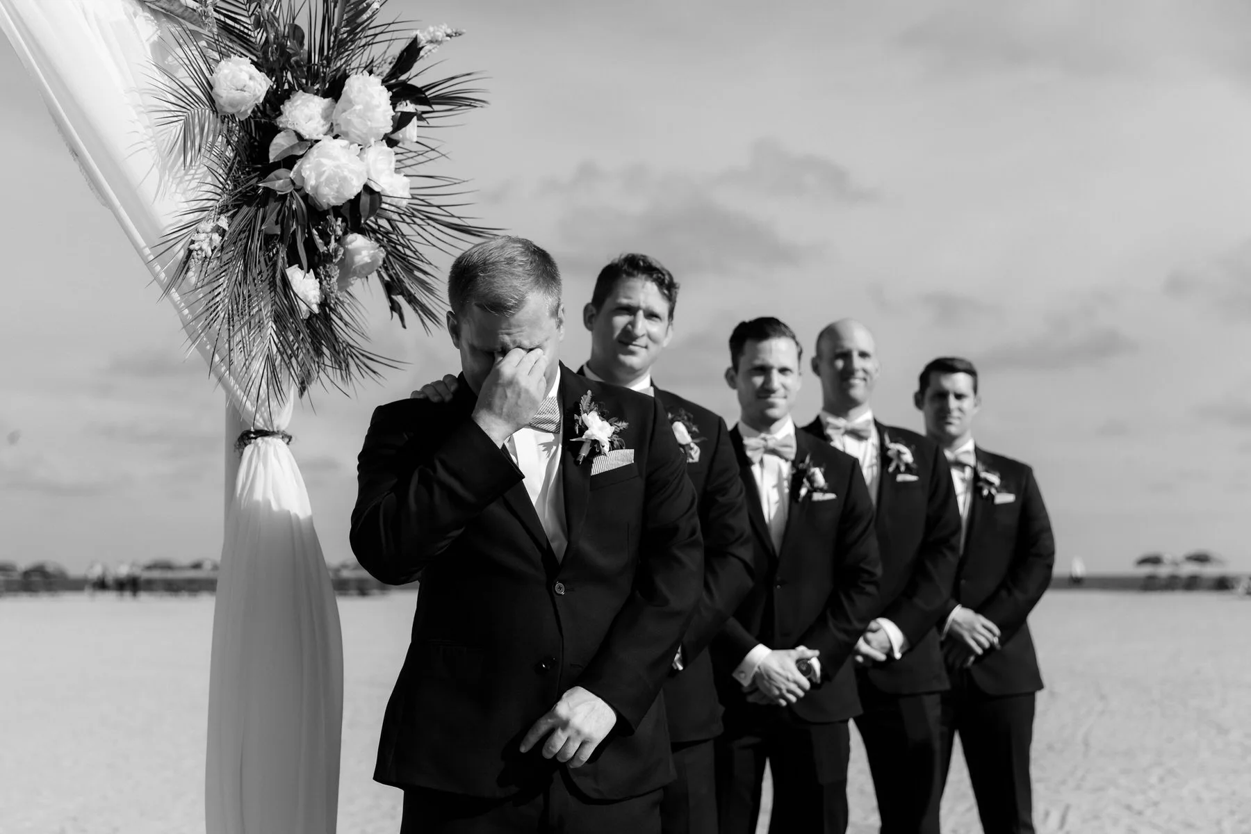 groom-crying-groomsmen-beach-wedding-charleston.jpg