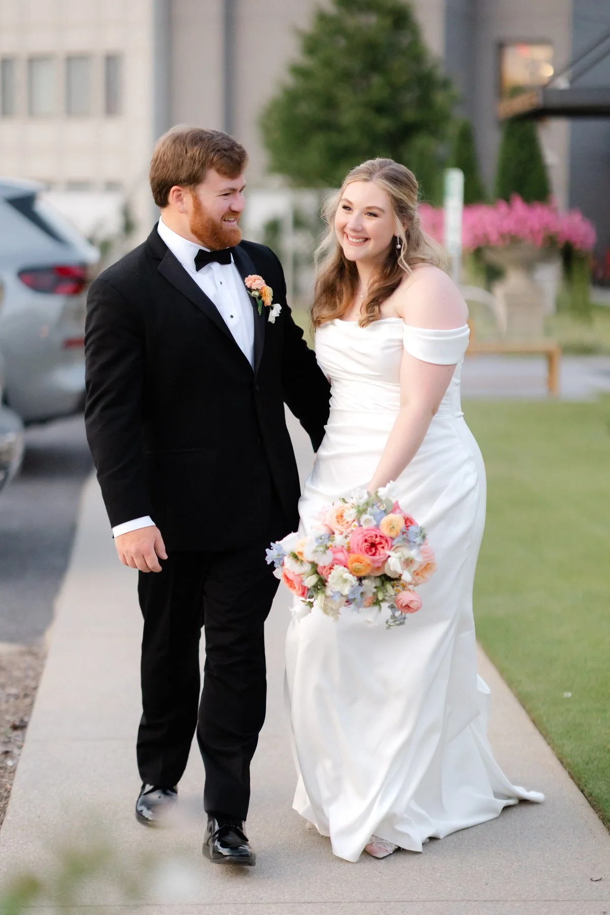bride-groom-walking-laughing-hotel-hartness-wedding.jpg
