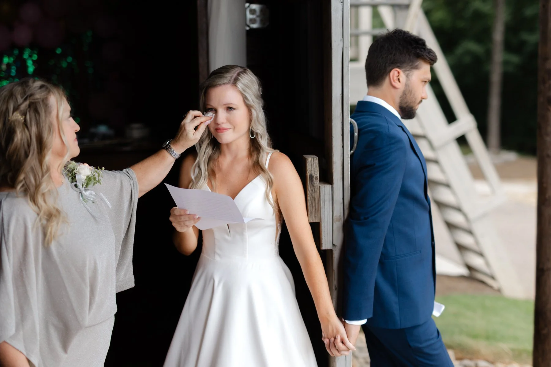 mother-bride-wiping-tears-first-touch-groom-wedding.jpg