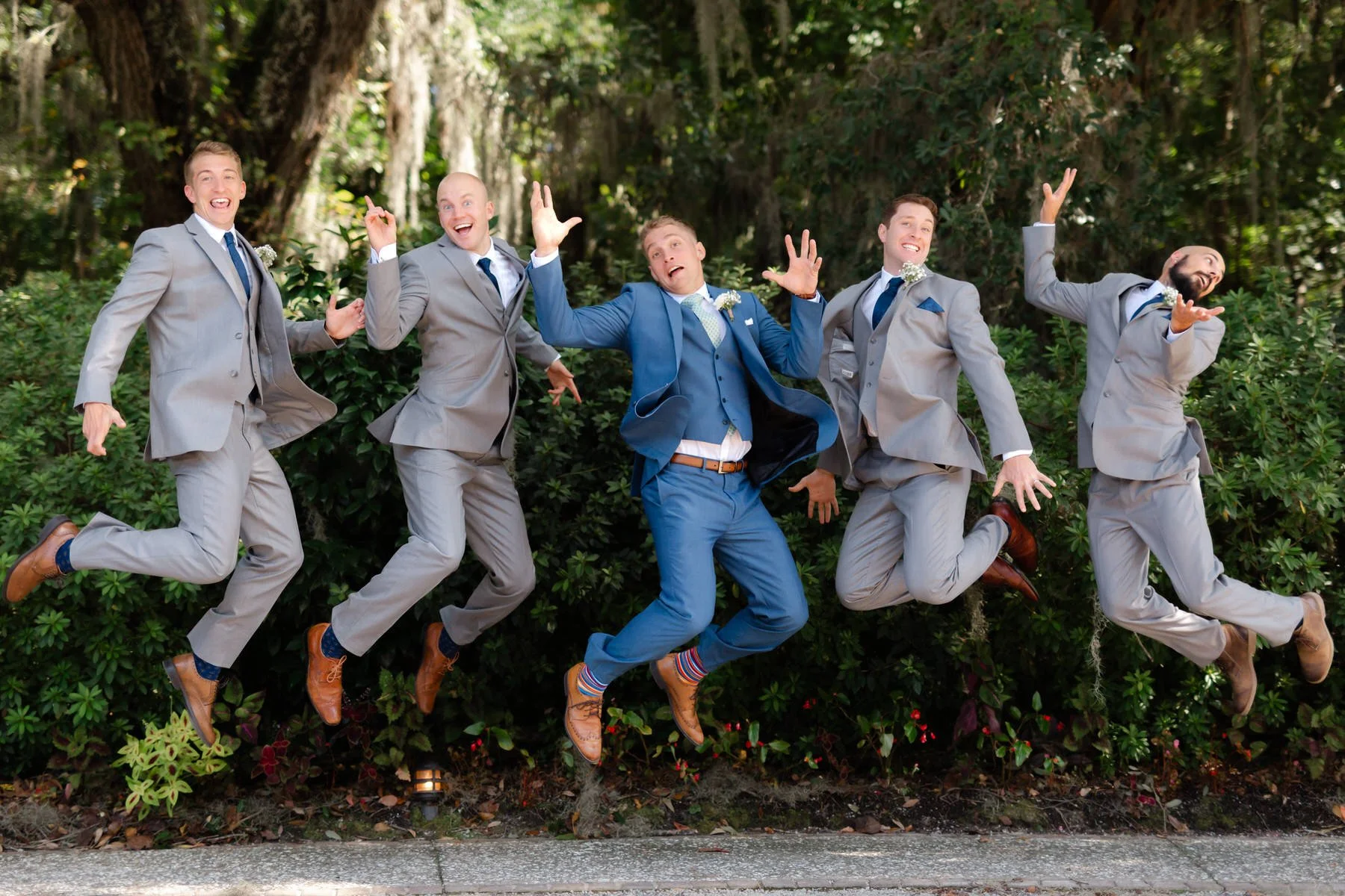groomsmen-groom-jumping-magnolia-plantation-charleston.jpg