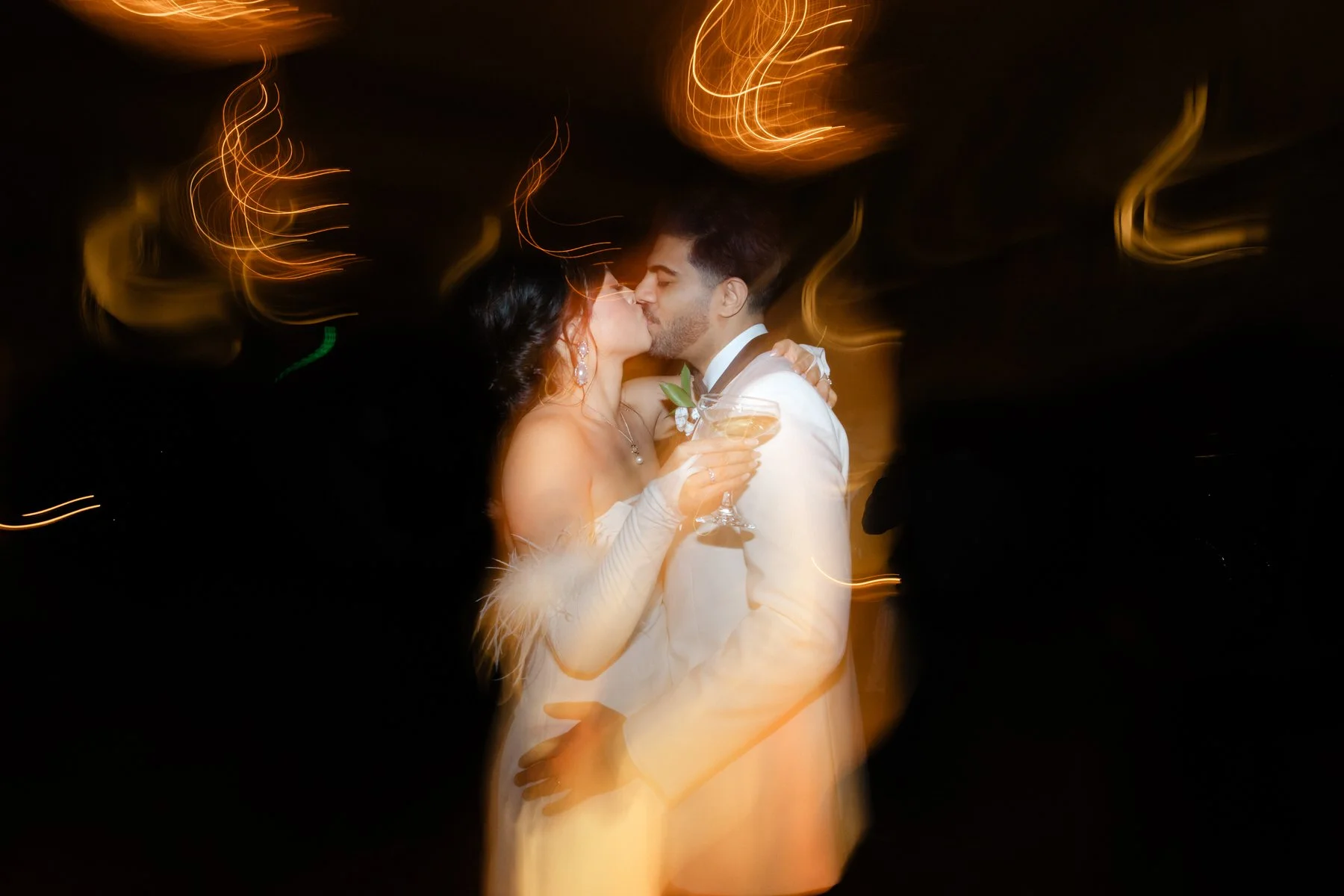 bride-groom-kissing-dance-floor-st-anthony-wedding.jpg