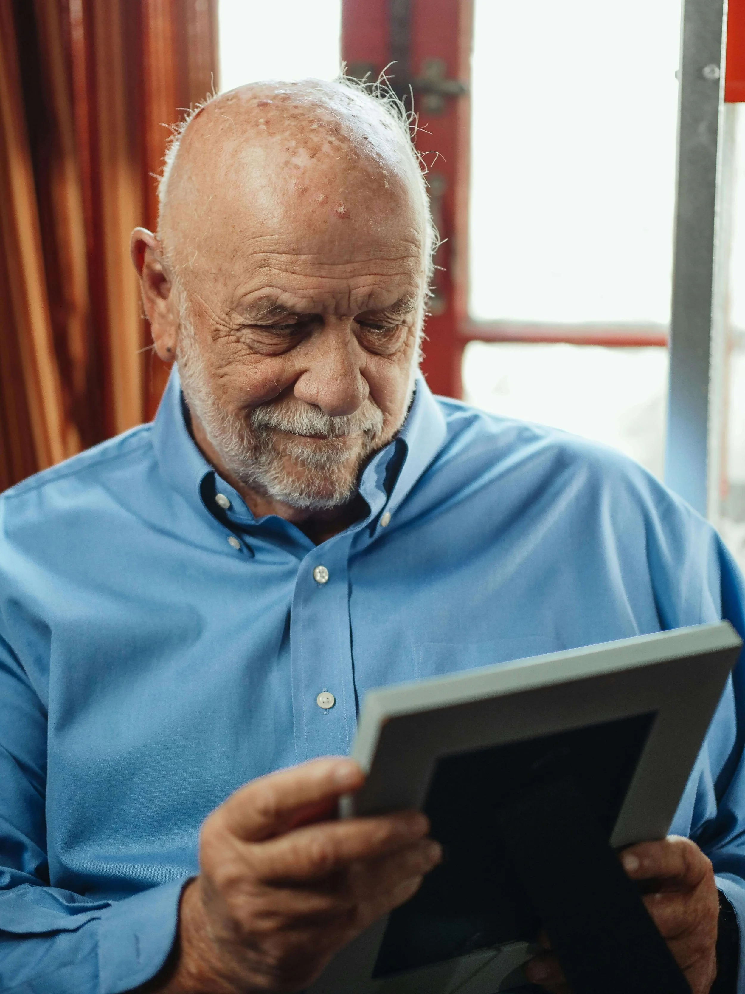 Older adult reviewing documents, illustrating the need for testamentary capacity assessment in Los Angeles, CA through geropsychology in South Bay, CA when cognitive changes occur