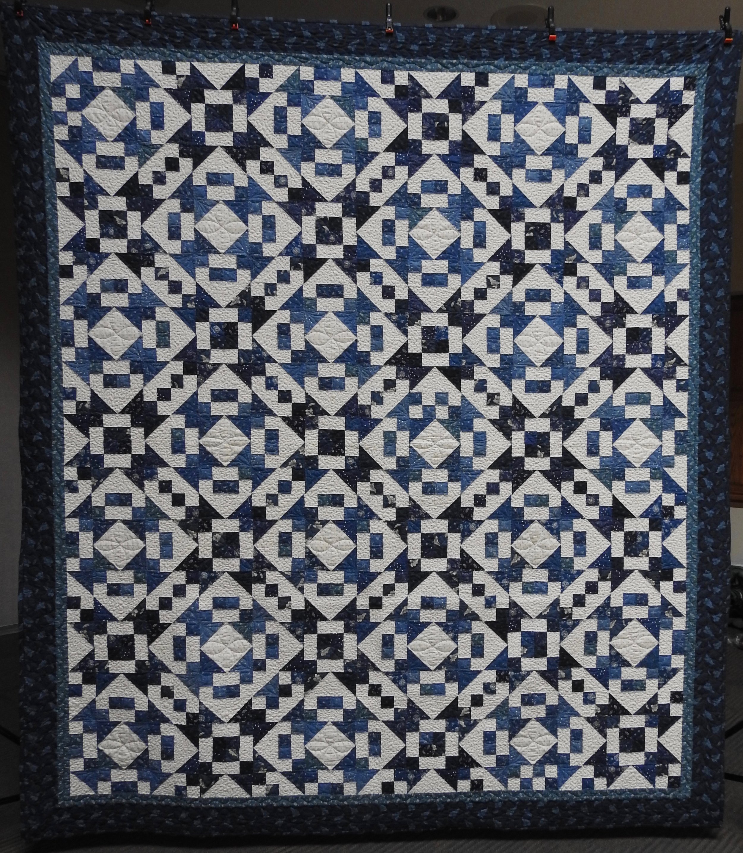 Glacial Blues, Pieced by Jean Mann Graber, Custom Machine Quilted, donated by the Cal Graber Family, 92 x 104”