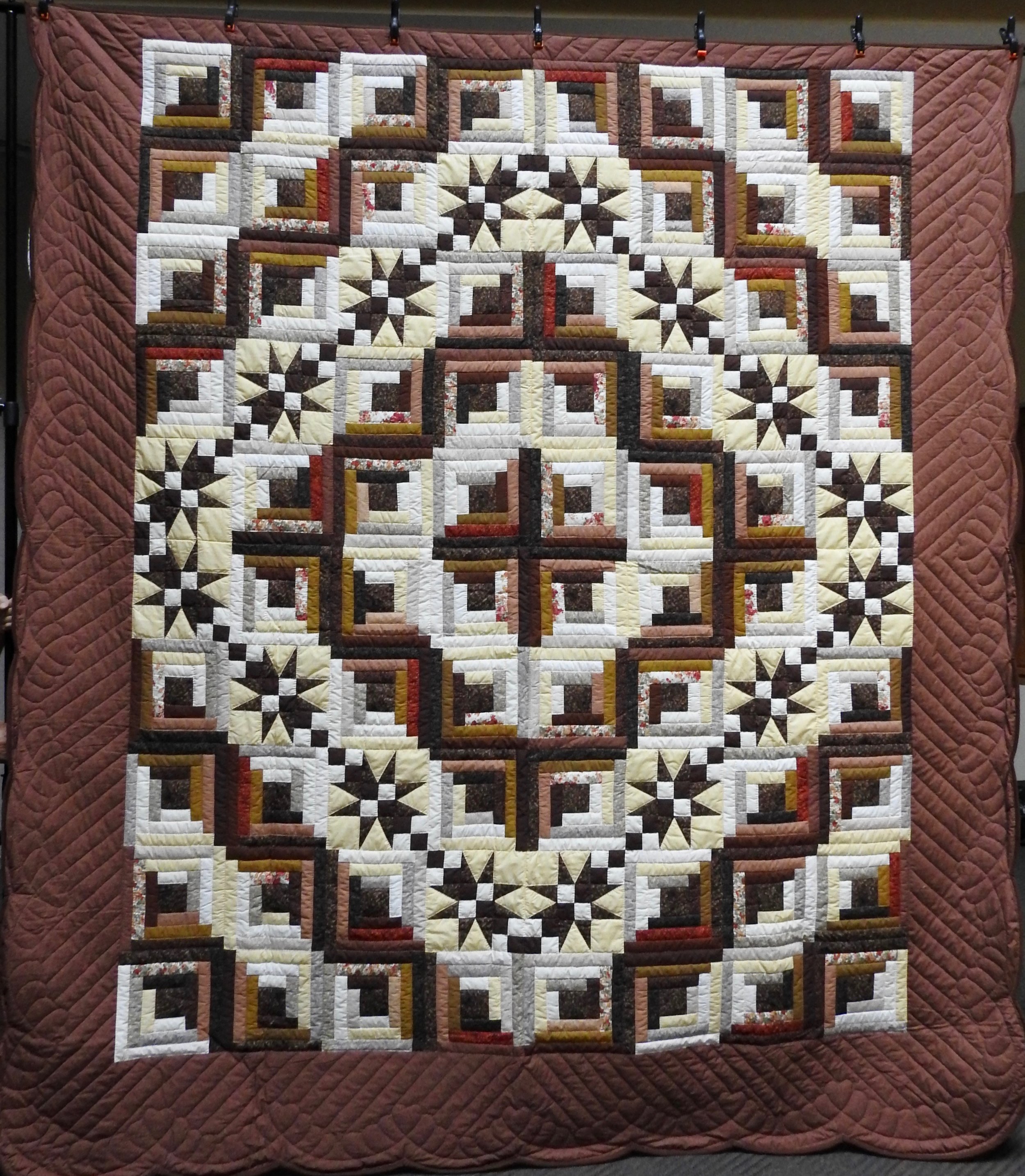 Many Star Log Cabin, Pieced, Hand Quilted, donated Anonymously, 100 x 113”