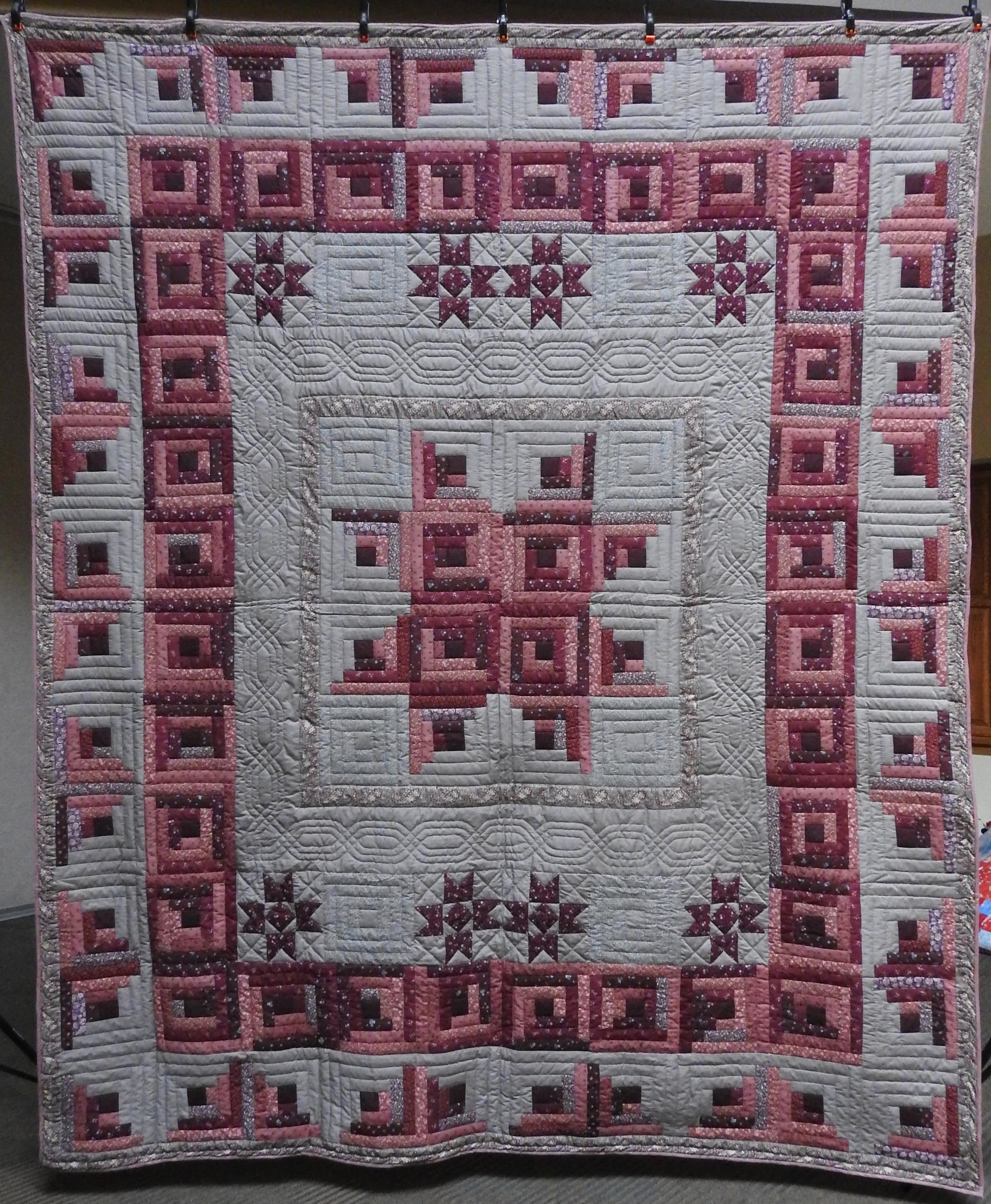 Stars over the Log Cabin, Pieced, Hand Quilted, donated by The Depot Quilt Room, 96 x 113”