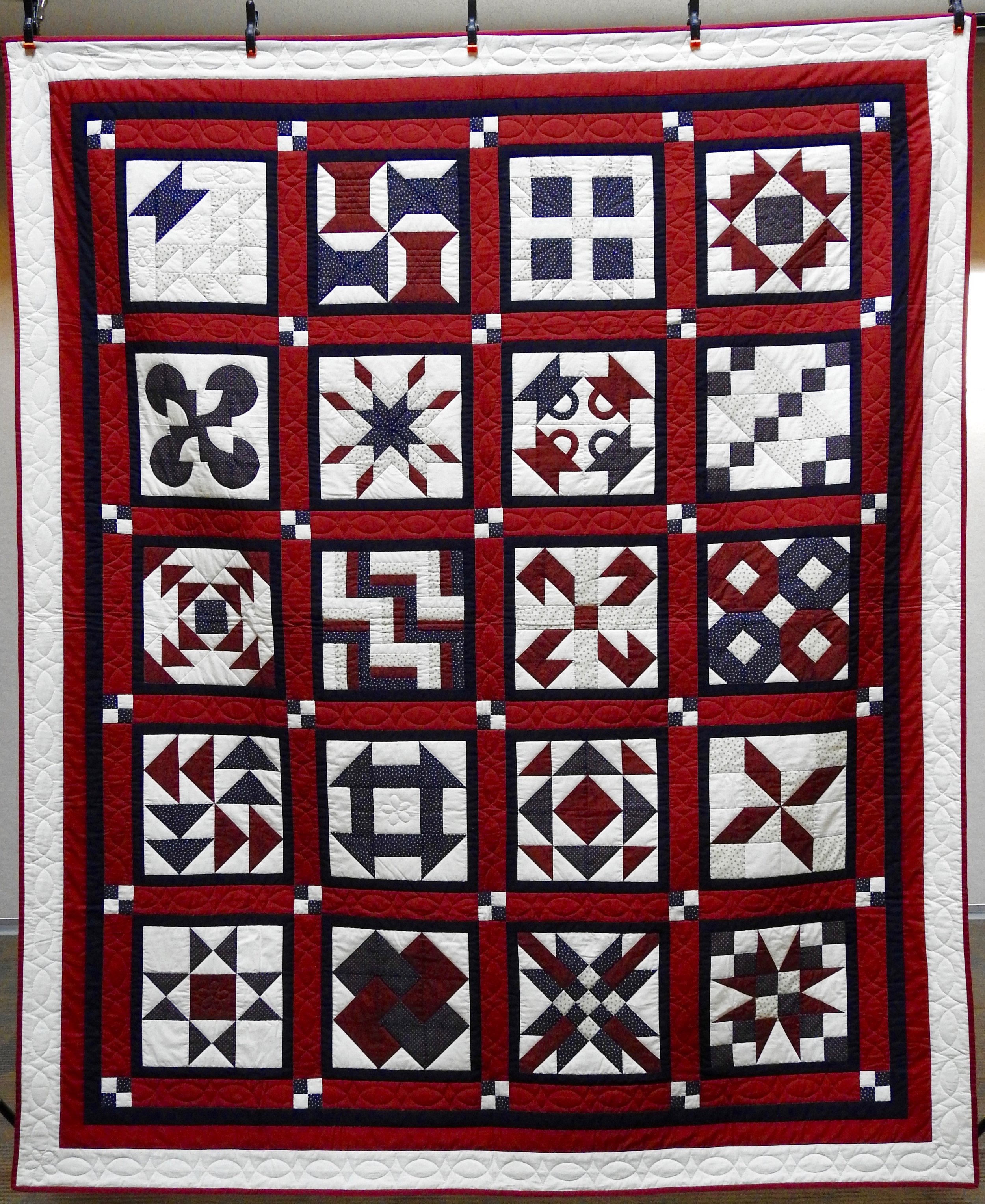 Red, White &amp; Blue Sampler, Pieced &amp; Hand Quilted by Isabel Leipprandt, Signed &amp; Dated, donated by Wayne &amp; Karen Moss, 73 x 98”