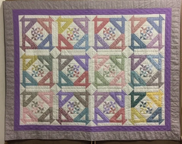 Disappearing Baskets & Pinwheels (Missouri Star pattern), Pieced, Single Needle Hand Quilted, donated by Silverwood Mennonite Women, 80 x 99”