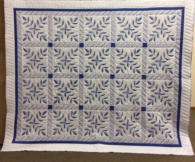 Blue Laurel Leaf, Pieced, Hand Embroidered by Adele Reichert, Single Needle Hand Quilted, donated by Silverwood Mennonite Women, 90 x 108”