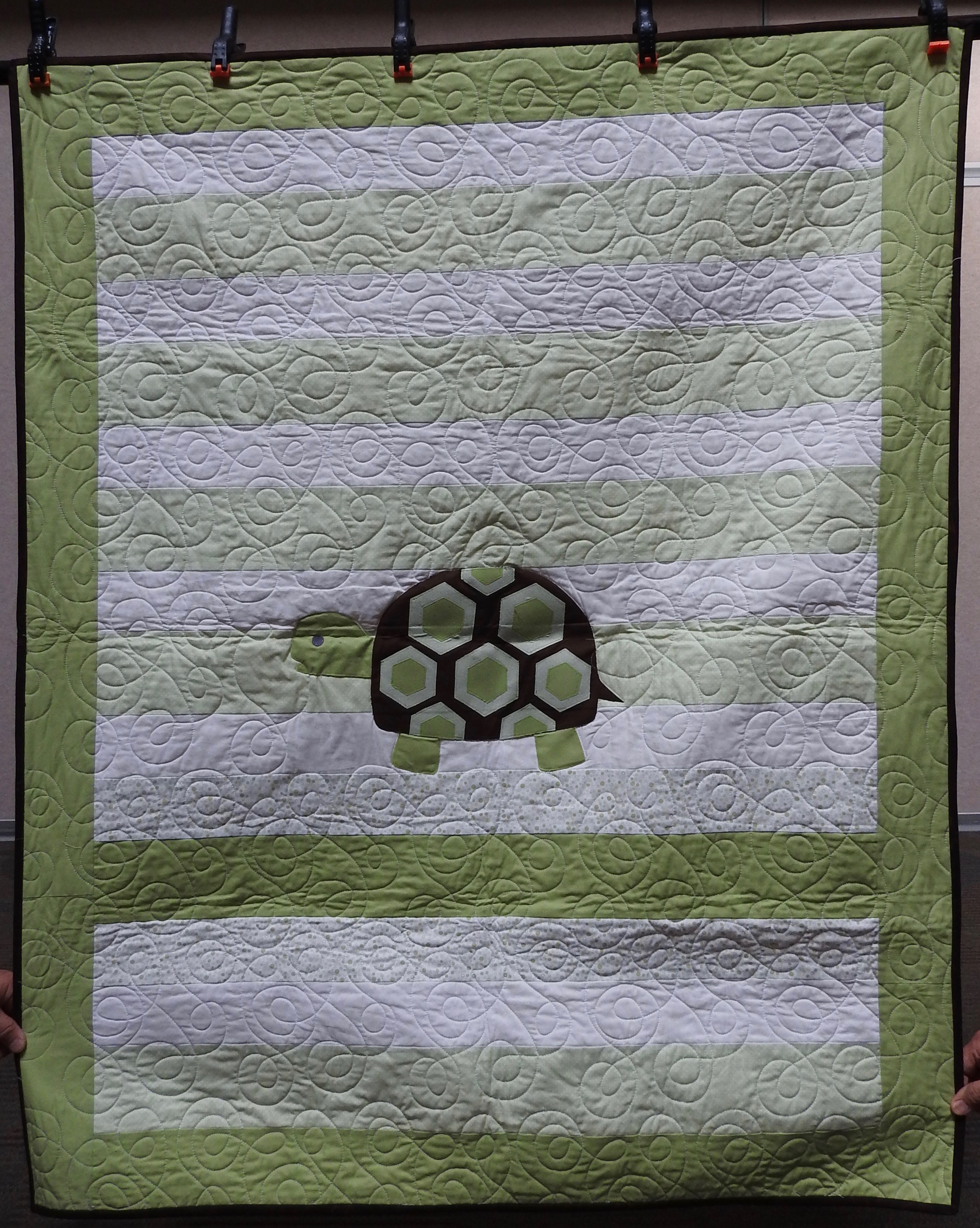 Ms. Turtle, Pieced, Machine Appliquéd, Edge to Edge Machine Quilted, donated anonymously, 44 x 54”