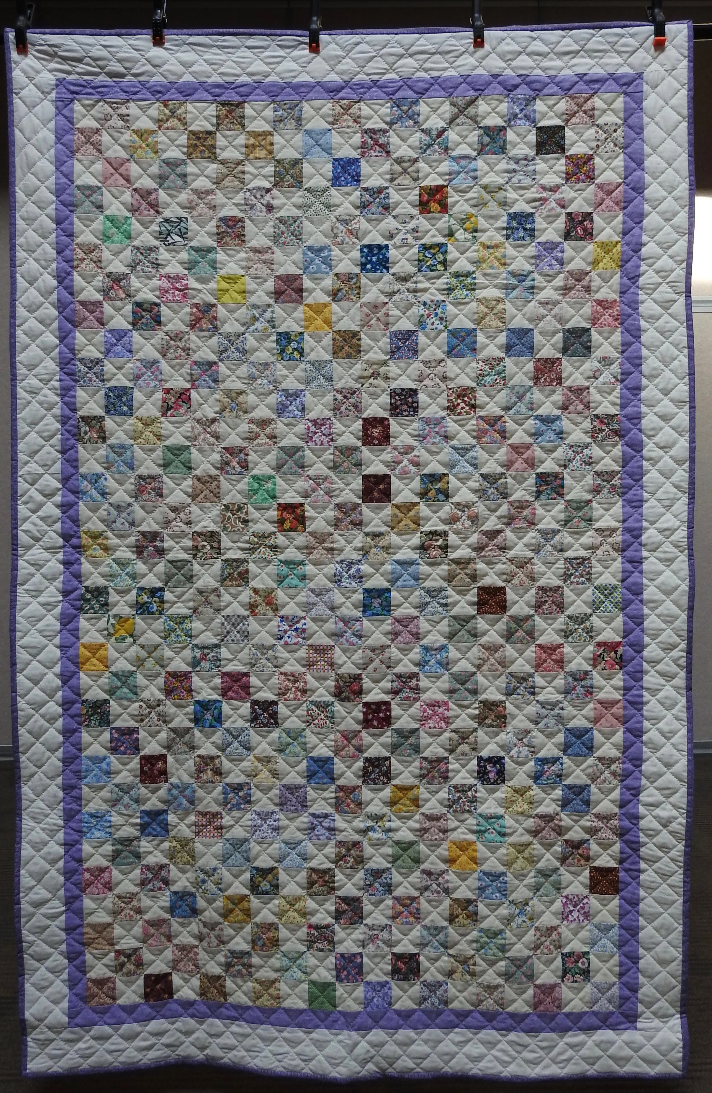 A Pastel Checkerboard, Pieced by Jean Hume Proudfoot, Hand Quilted by Evergreen Place Quilters, donated by David & Mary Anne Proudfoot, 52 x 80”