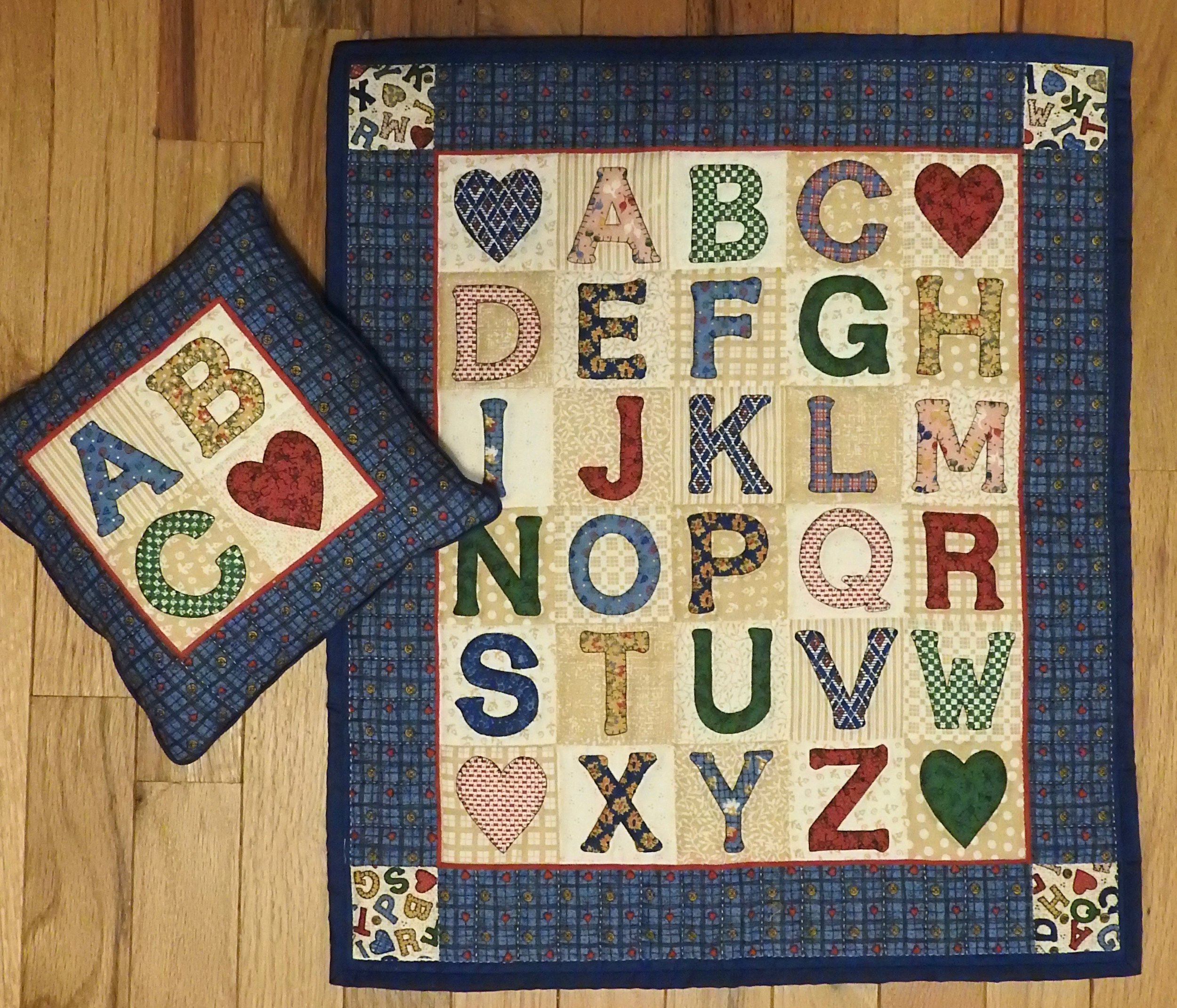 Alphabet Doll Quilt with Pillow, Pre-printed, Hand Quilted and donated by Virginia A. Hartsough, 17 x 20”