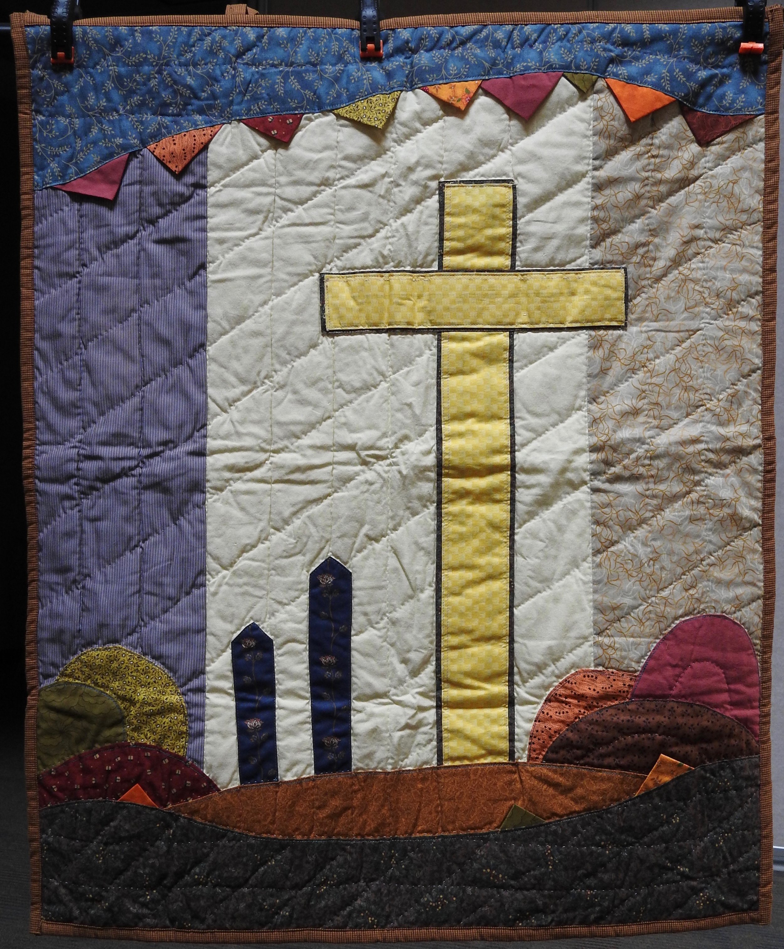 Cross in Autumn, Pieced &amp; Appliquéd, Hand Quilted, donated by Howard-Maimi Mennonite Church, 29 x 36”
