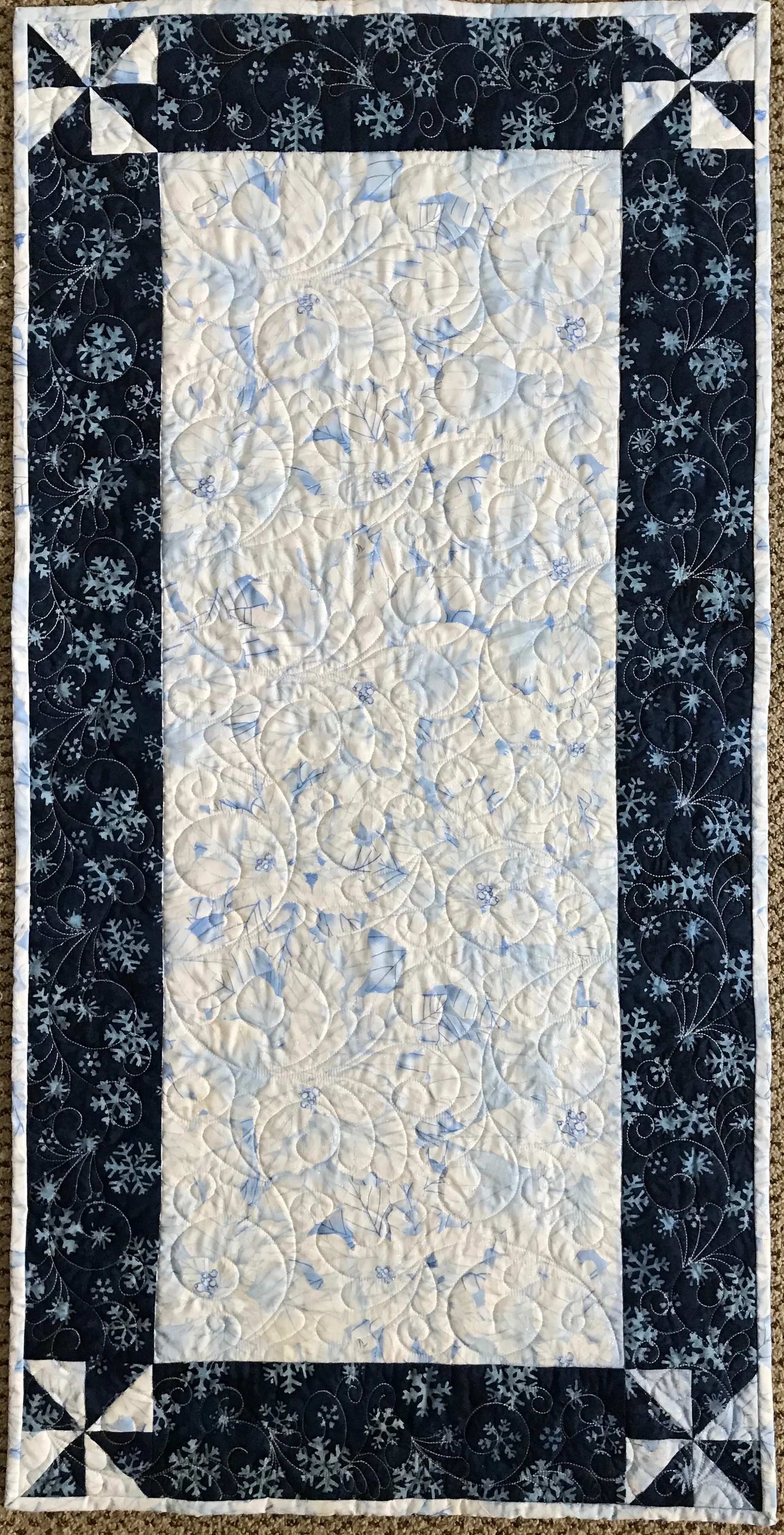 Winter’s Sparkle, Pieced & Custom Machine Quilted by Debra Detwiler, donated by Debra Detwiler, 21 x 42”
