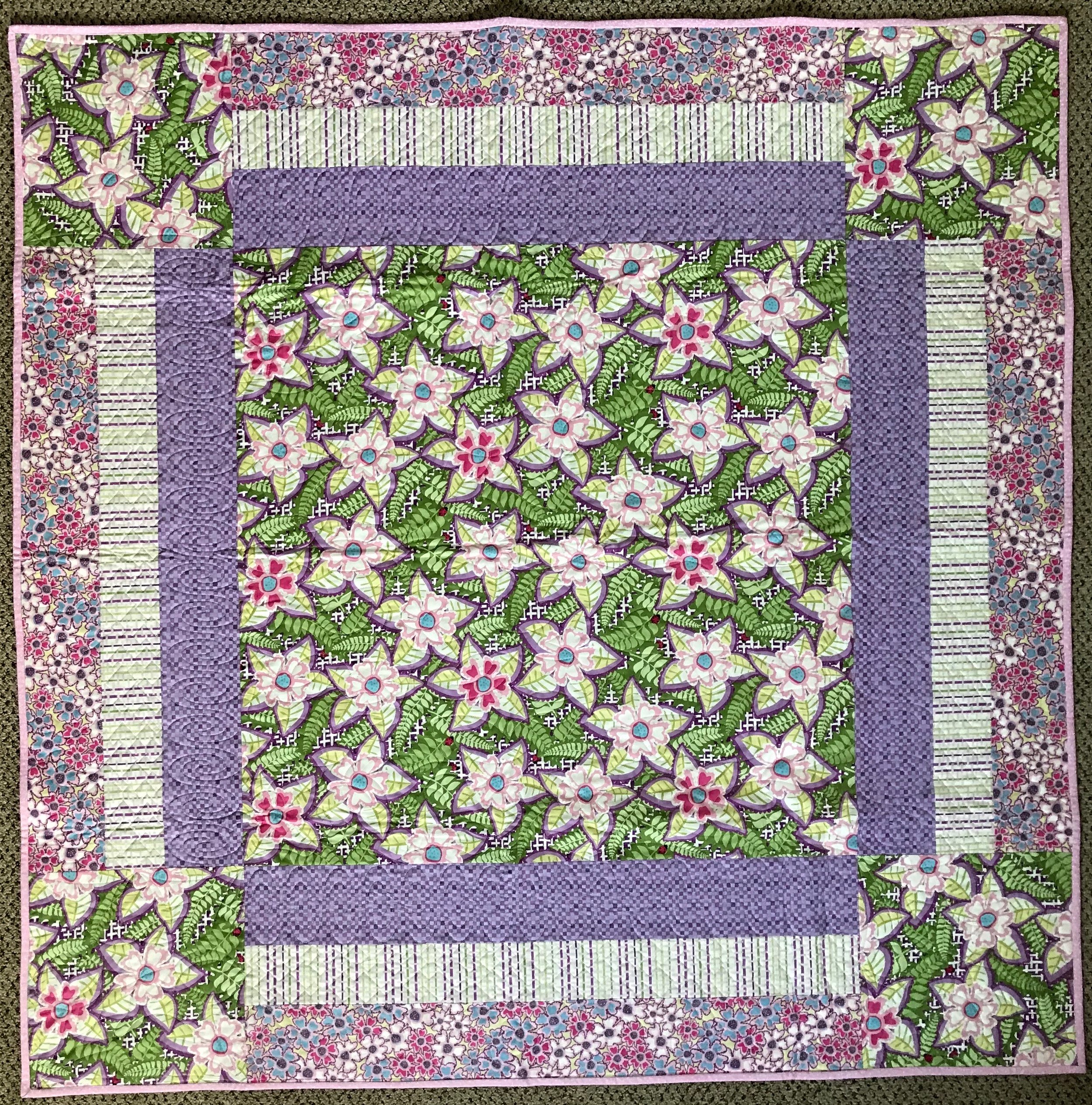 Flowers Galore, Pieced, Hand Quilted, donated by Phyllis Schrag, 54 x 54”
