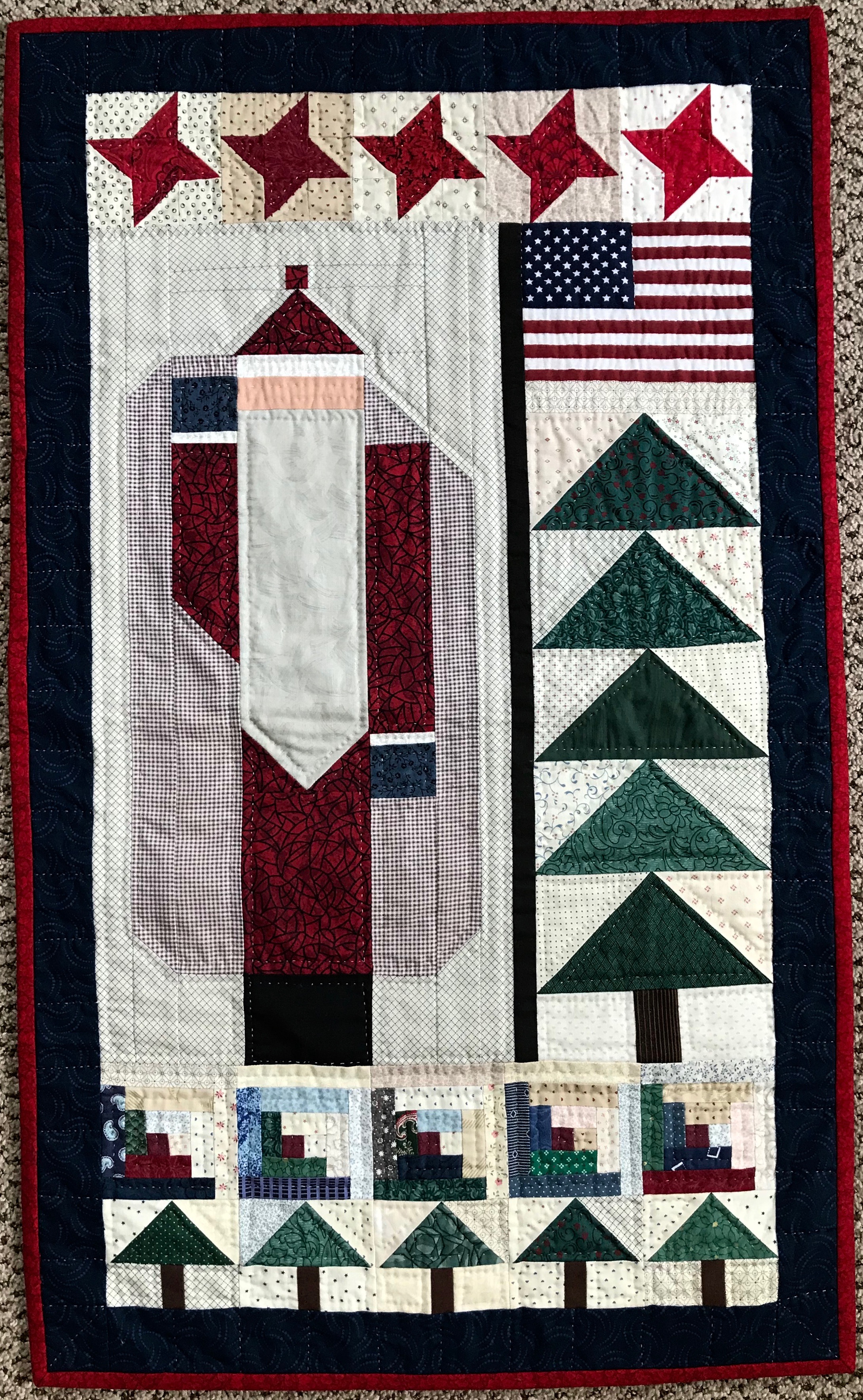 Santa in the Pines, Pieced, Hand Quilted, donated by Phyllis Schrag, 19 x 32”