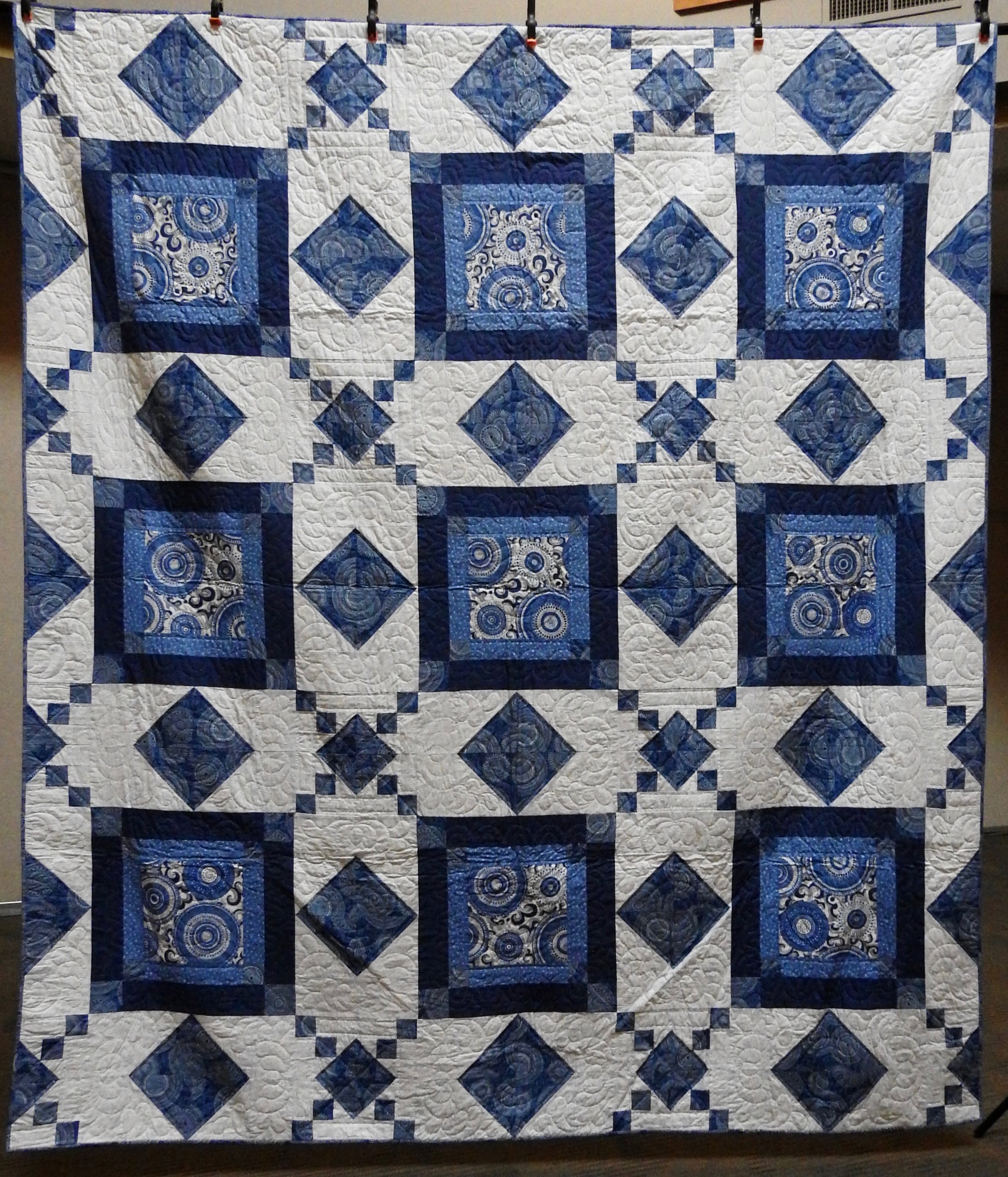 Blue Swirl, Pieced by Linda Stenberg, Single Needle hand Quilted by Marilouise Hagenberg, donated by the Linda Stenberg Estate, 94 x 107”