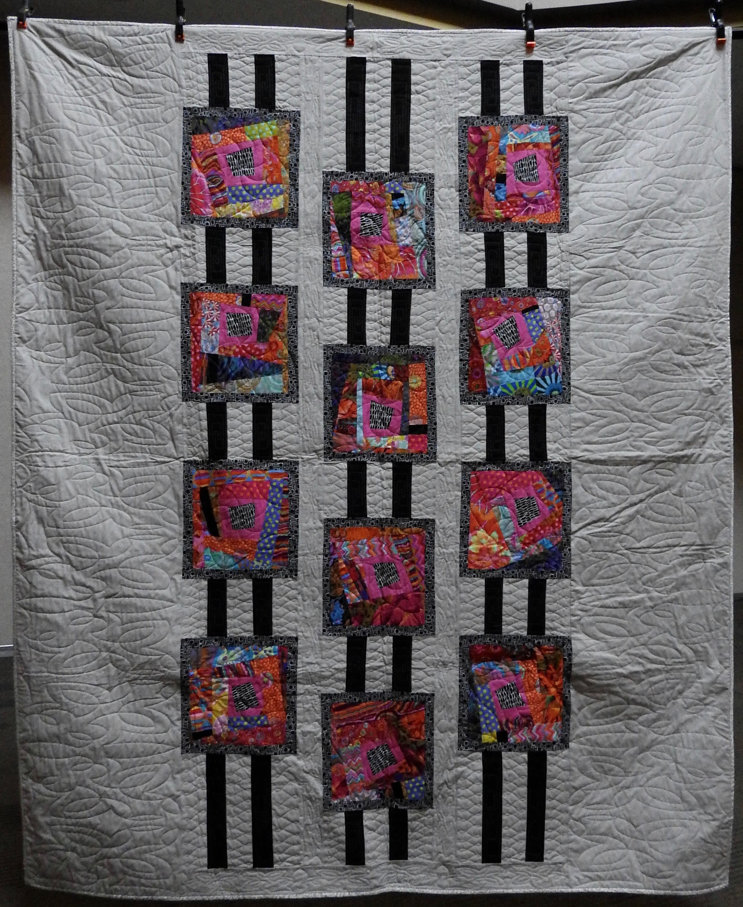 Child’s Game of Jacob’s Ladder, AKA Clock Clack, Pieced, (Pattern by Mary Pepper), Custom Machine Quilted, donated by Phyllis Schrag, 80 x 93”