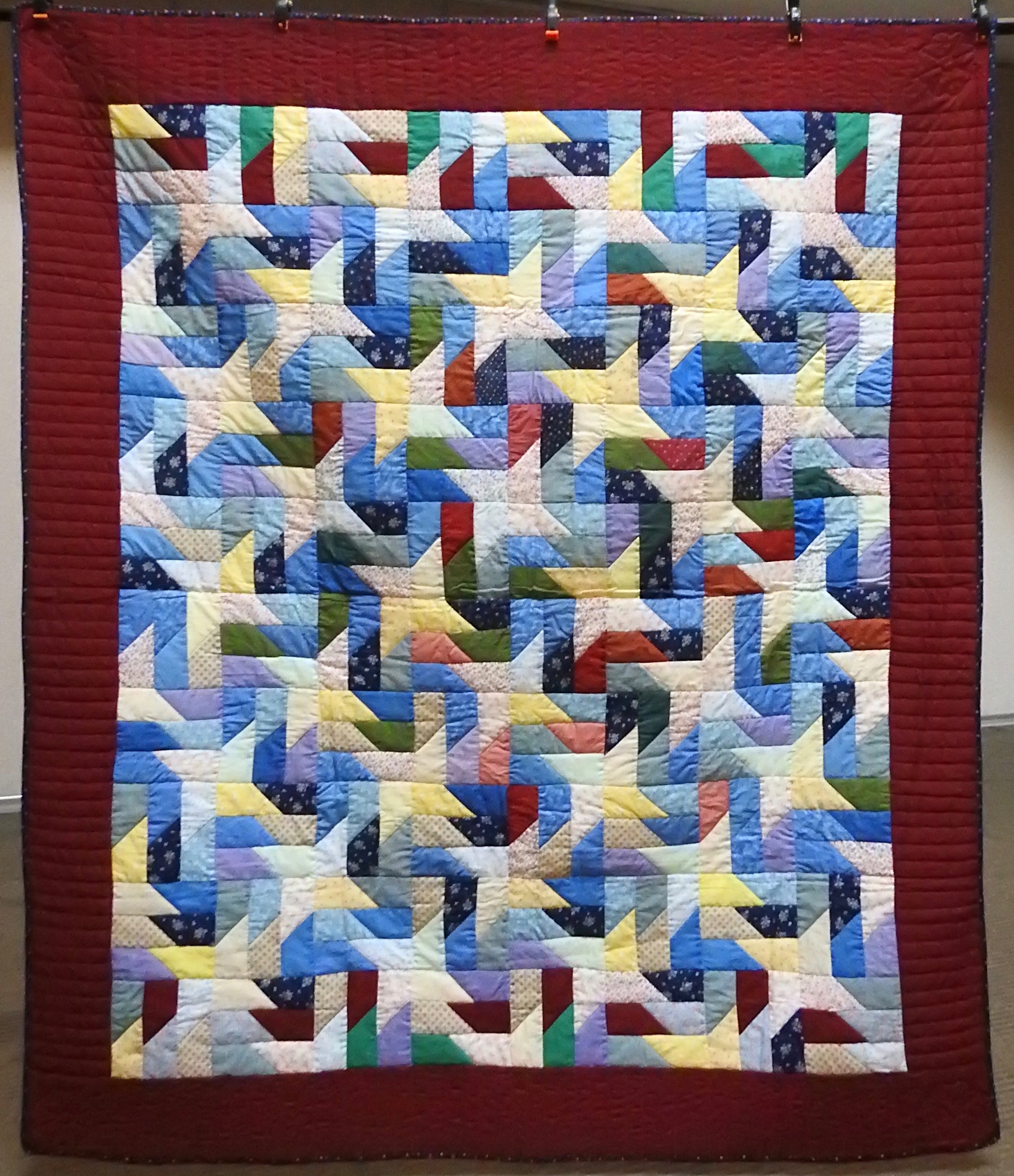 Scrappy Pinwheel, Pieced &amp; Hand Quilted, 72 x 82”