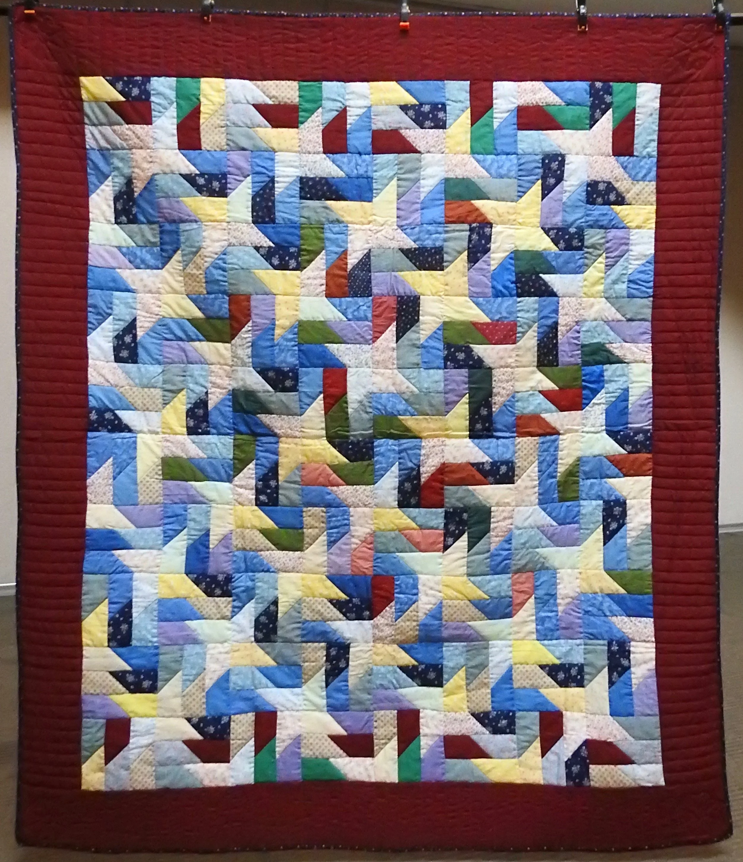 Scrappy Pinwheel, Pieced & Hand Quilted, 72 x 82”