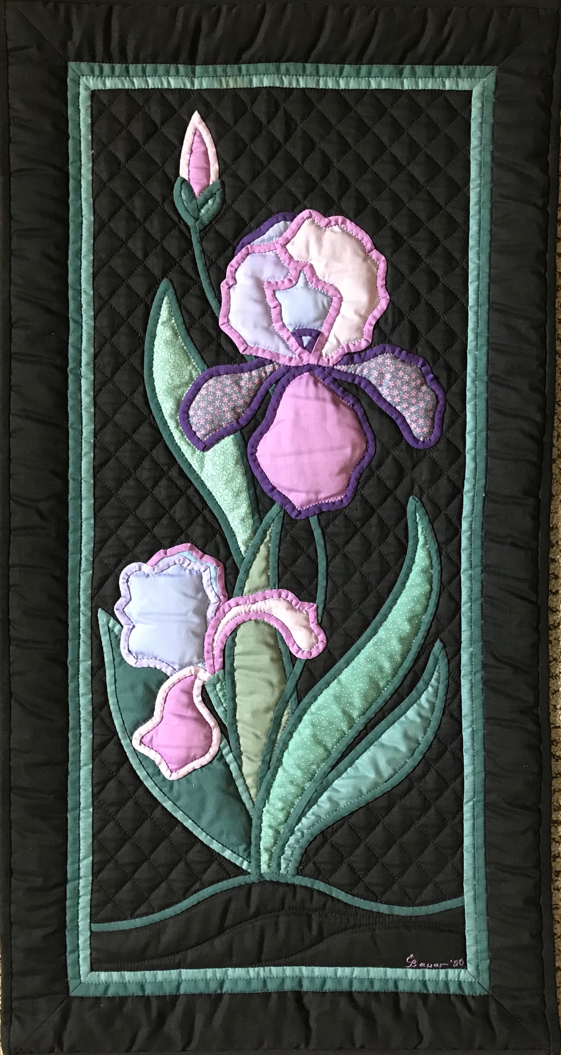 Iris, Pieced, Appliquéd &amp; Hand Quilted by Evelyn Bauer, donated by Steve McClain,17 x 32”