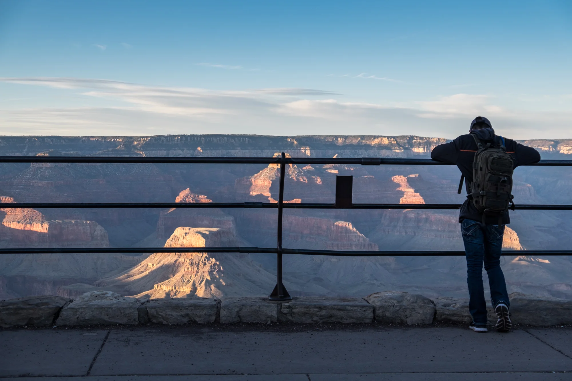 A traveler takes in the beauty of the South Rim. 