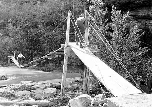 Love this cool old photo! Mr. Arthur Newton Pack, of Nature Magazine, taking motion picture of Mr. Brian on suspension bridge in front of Zion Lodge c. 1929. Copyright George A. Grant / Zion National Park