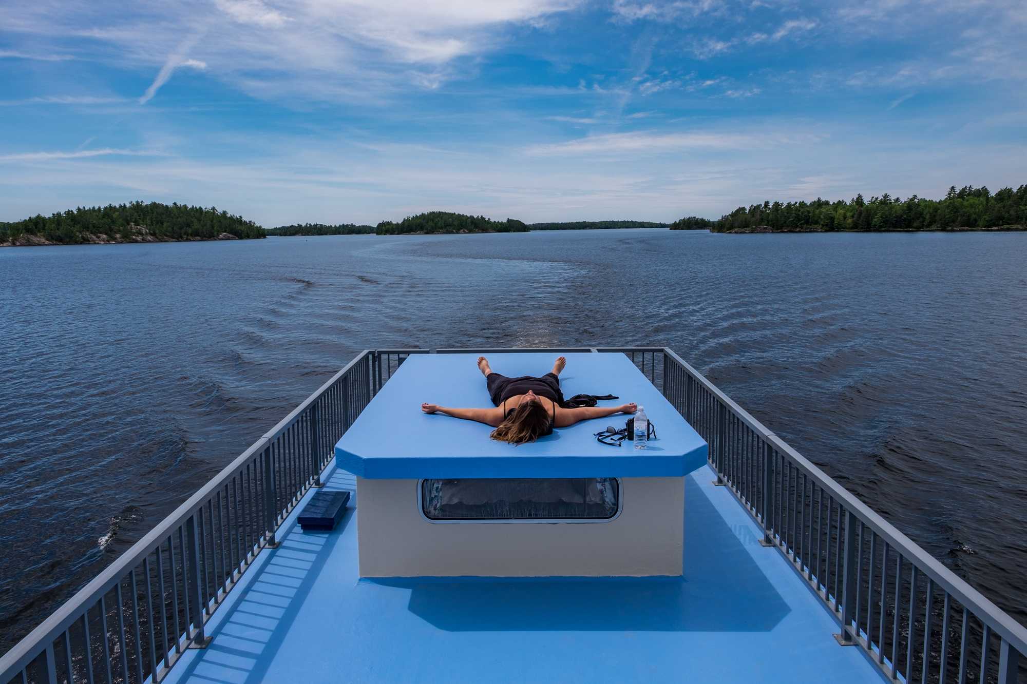 Stef fully enjoying lazy days on the roof deck of the houseboat. 