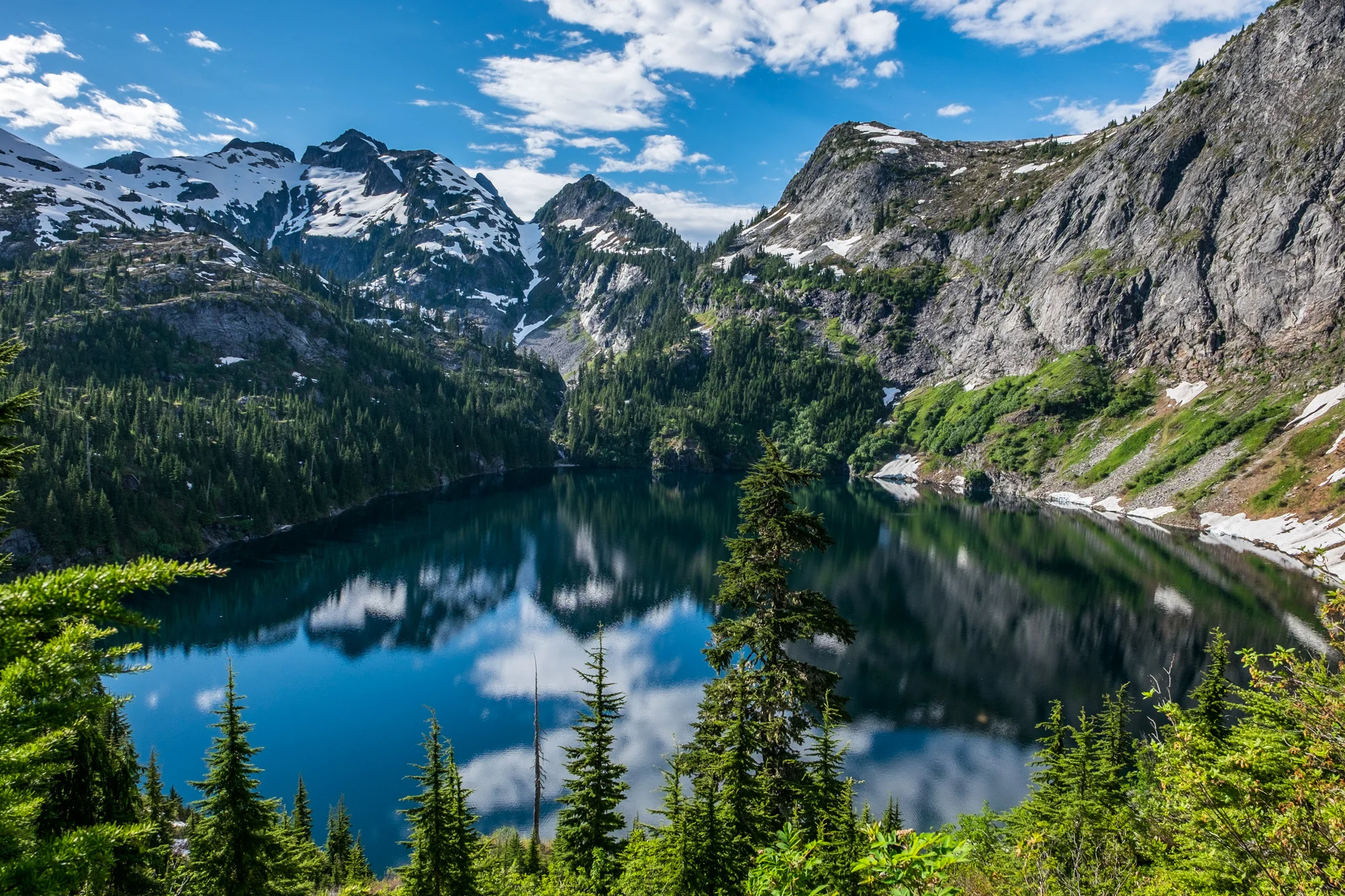 Backcountry beauty found at Thornton Lake. It's not an easy trek to make it here, but it pays off in spades! (Backcountry camping spot situated at the left side of this photo.)