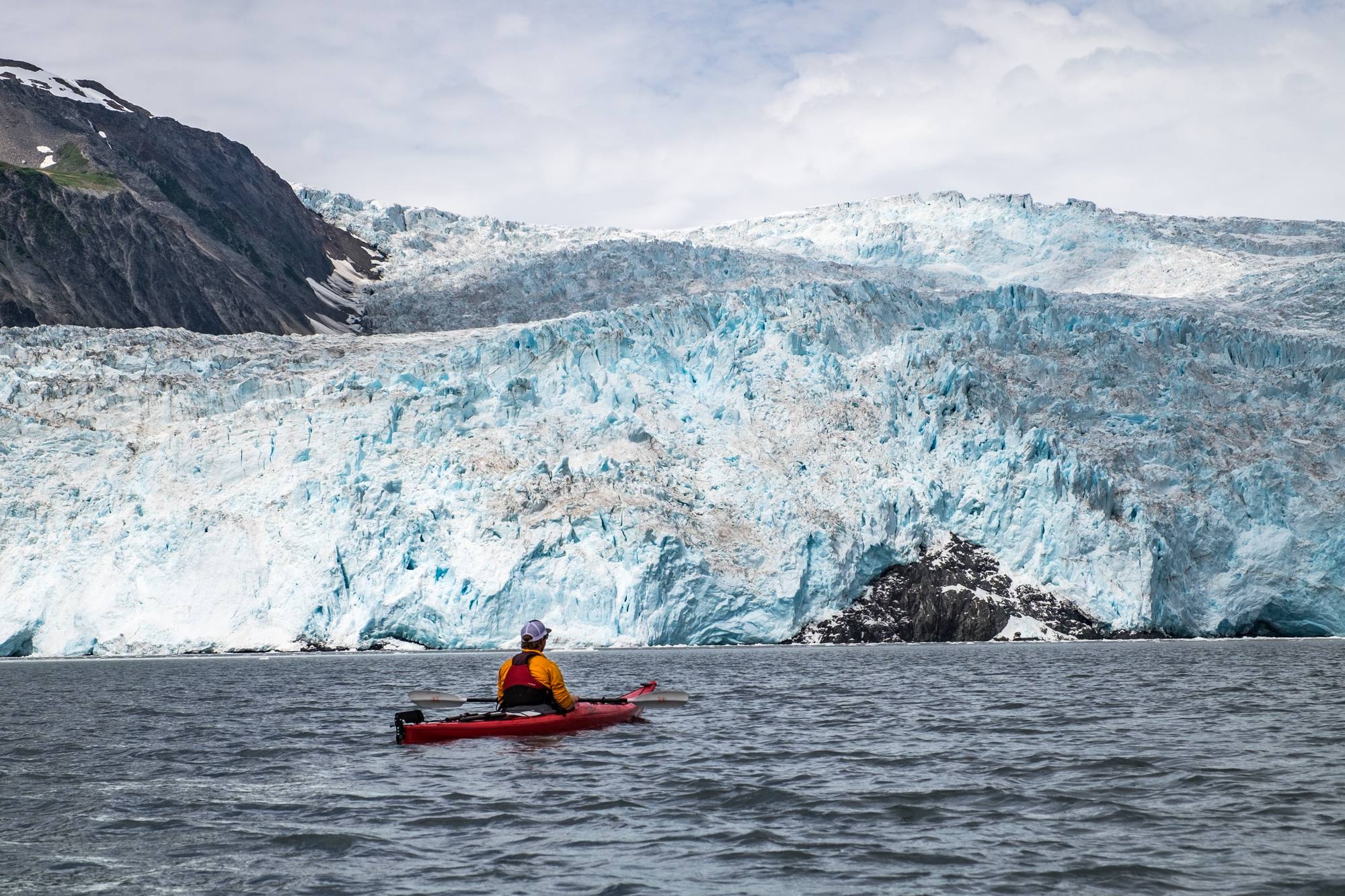 Kayaking next to the Aialik Glacier in Aialik Bay, one of the most active glaciers in Kenai Fjords National Park. 
