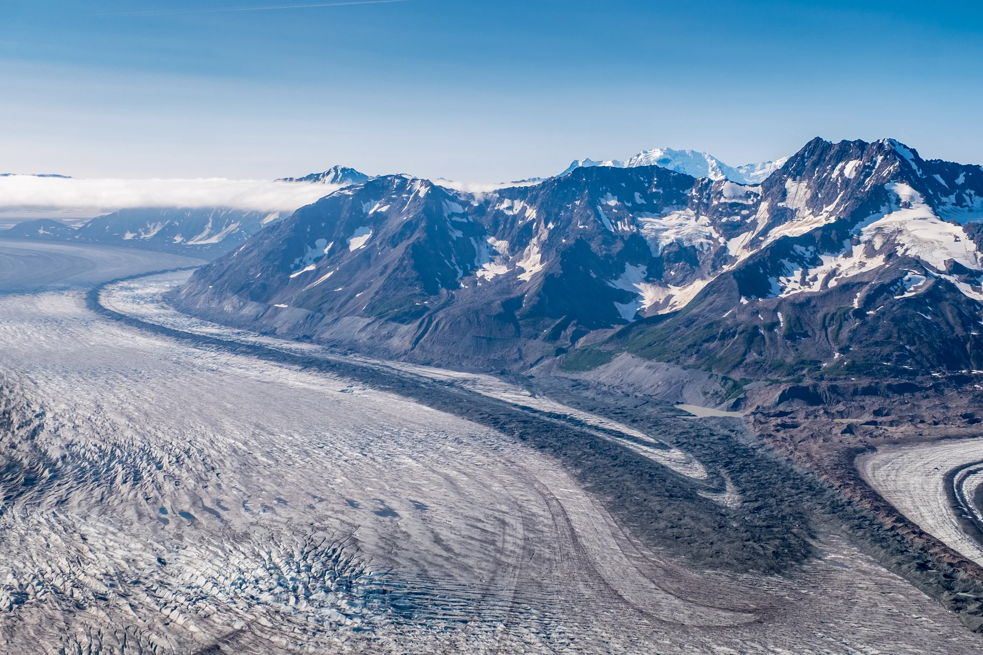 Wrangell St. Elias National Park and Preserve in Alaska from the air, shows the variety of distinct geological features that comprise this amazing region in southeast Alaska—glaciers, ice fields, alpine mountains, moraine, tundra...and that's just what you can see in this photo!