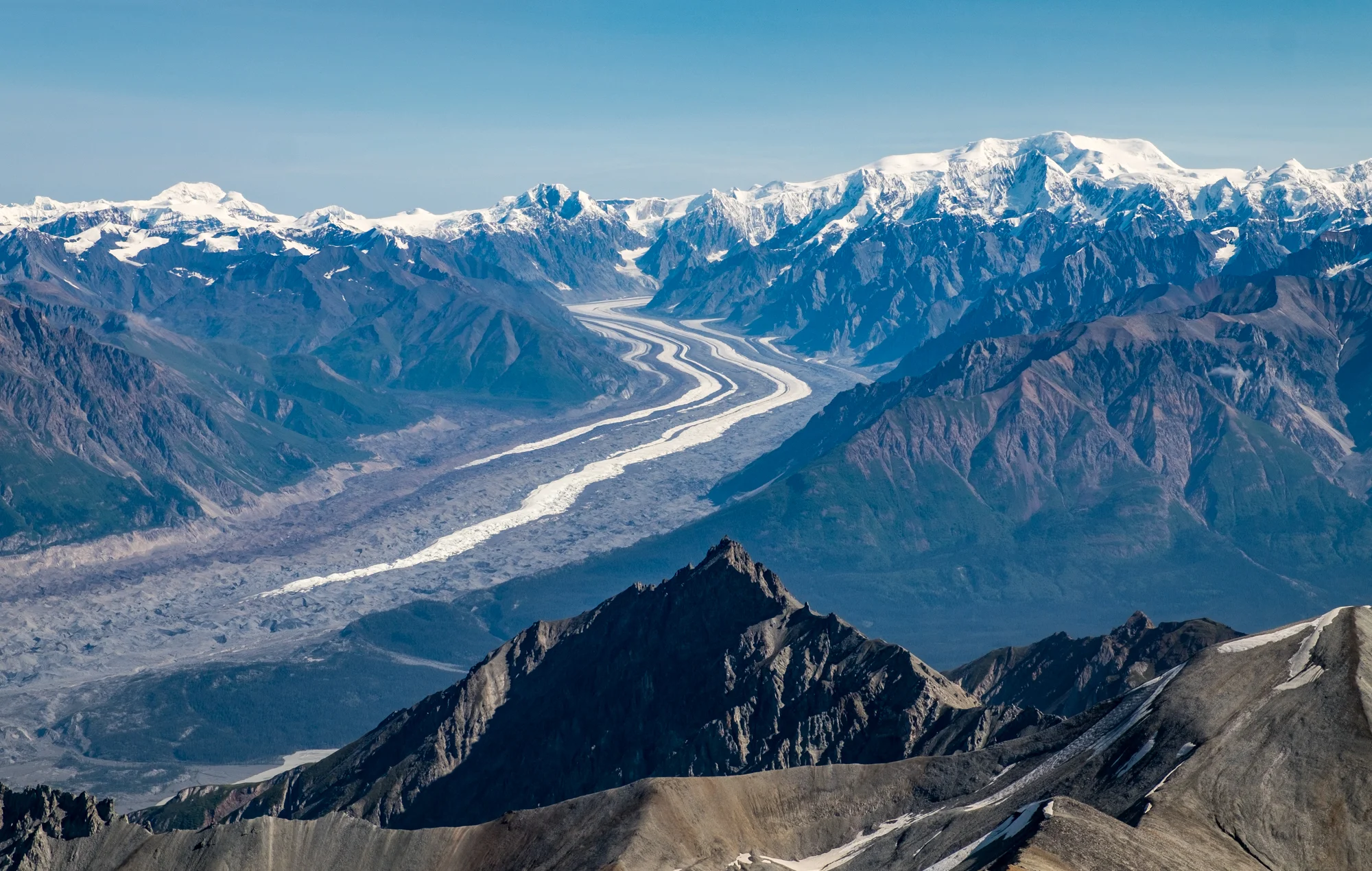 The St. Elias Mountain range gives way to glaciers and moraine. See that vertical spread of white and brown strips? We crossed all of that during our five day backpacking adventure. Awesome!!