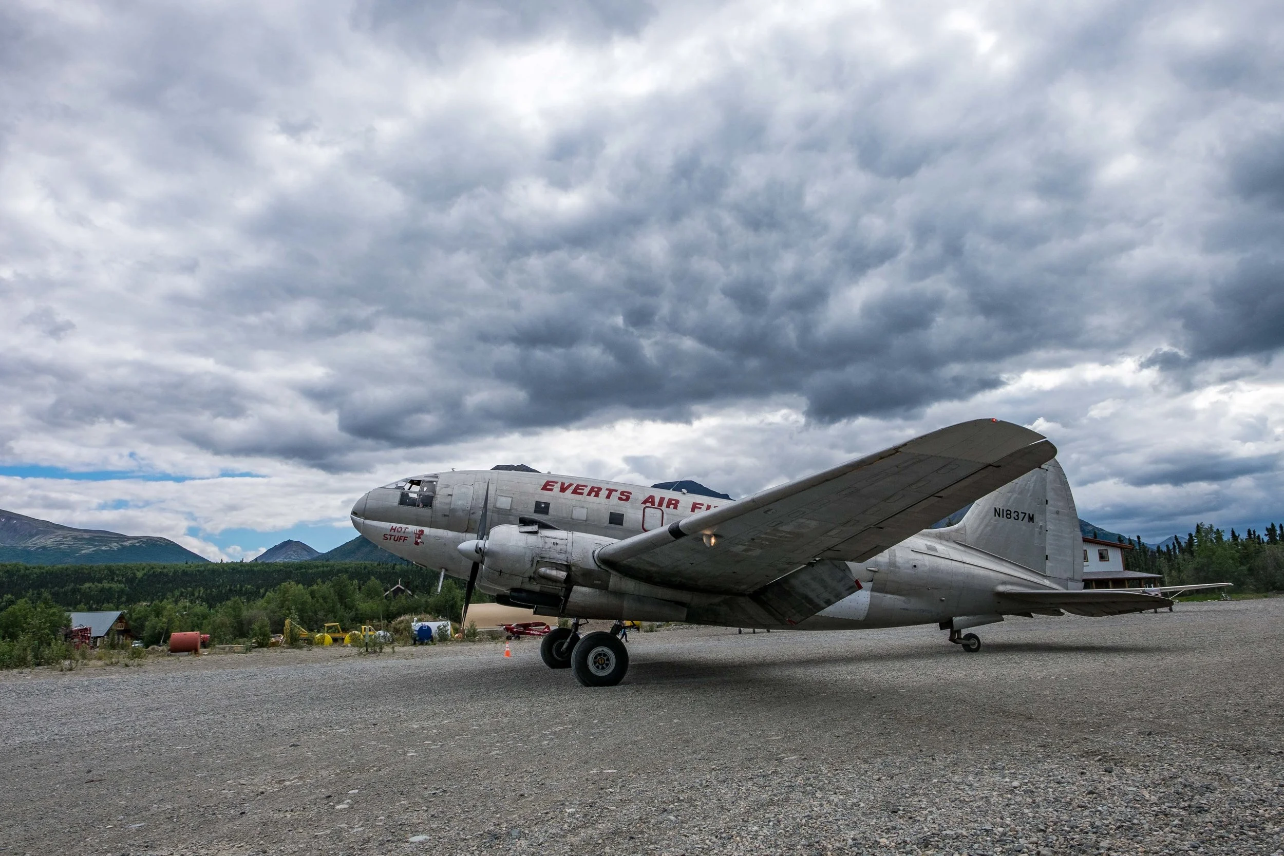 A Curtis C-46 plane lands in Port Alsworth bringing fuel to the area. 