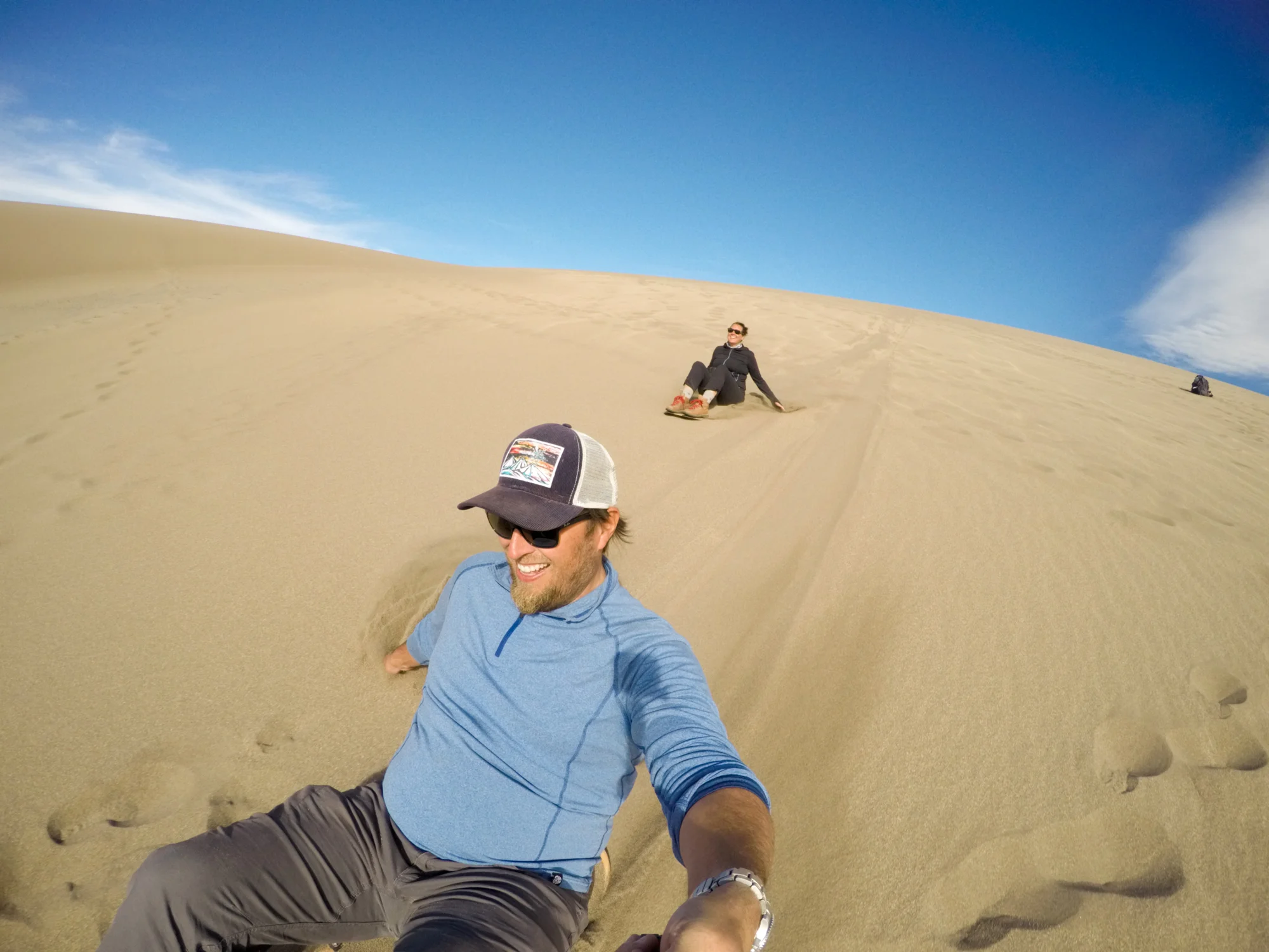 Flying down the dunes on our rented sand-boards! 