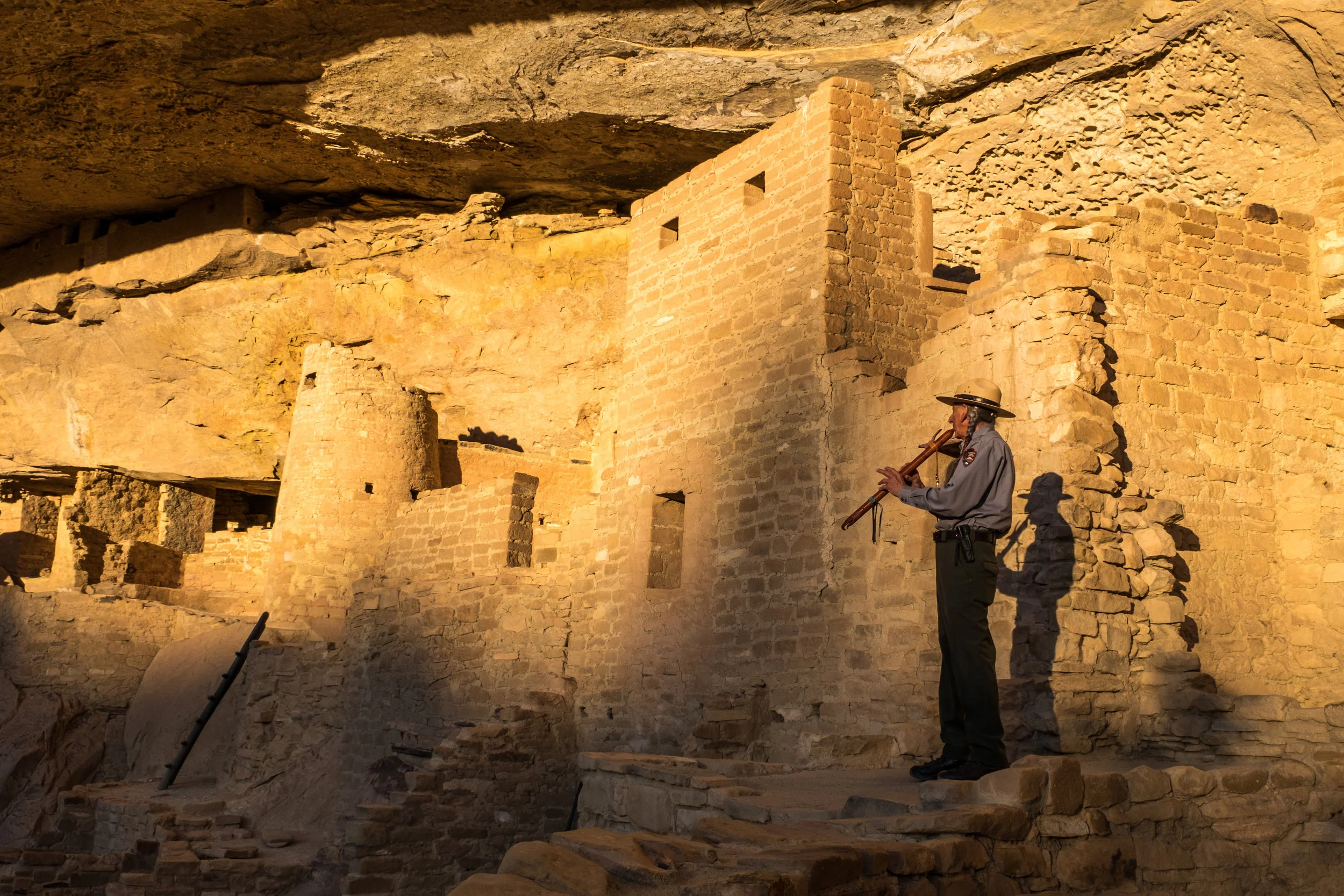 Park Ranger David Nighteagle offers a song to his ancestors inside Cliff Palace. 