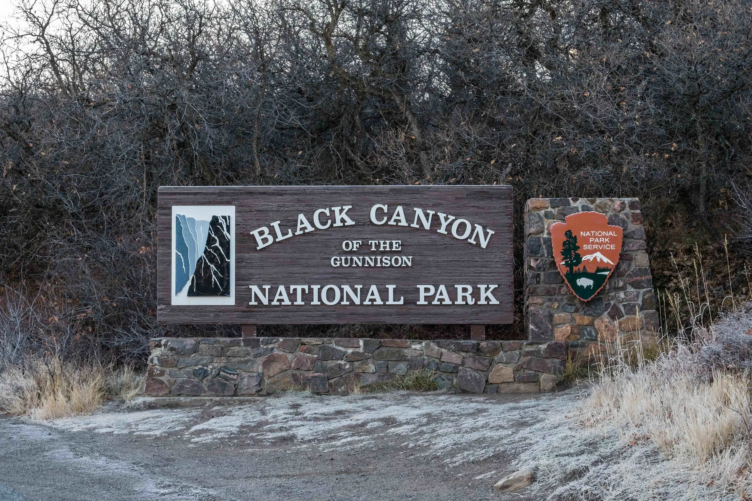 The park entrance sign to Black Canyon of the Gunnison National Park in Colorado. 