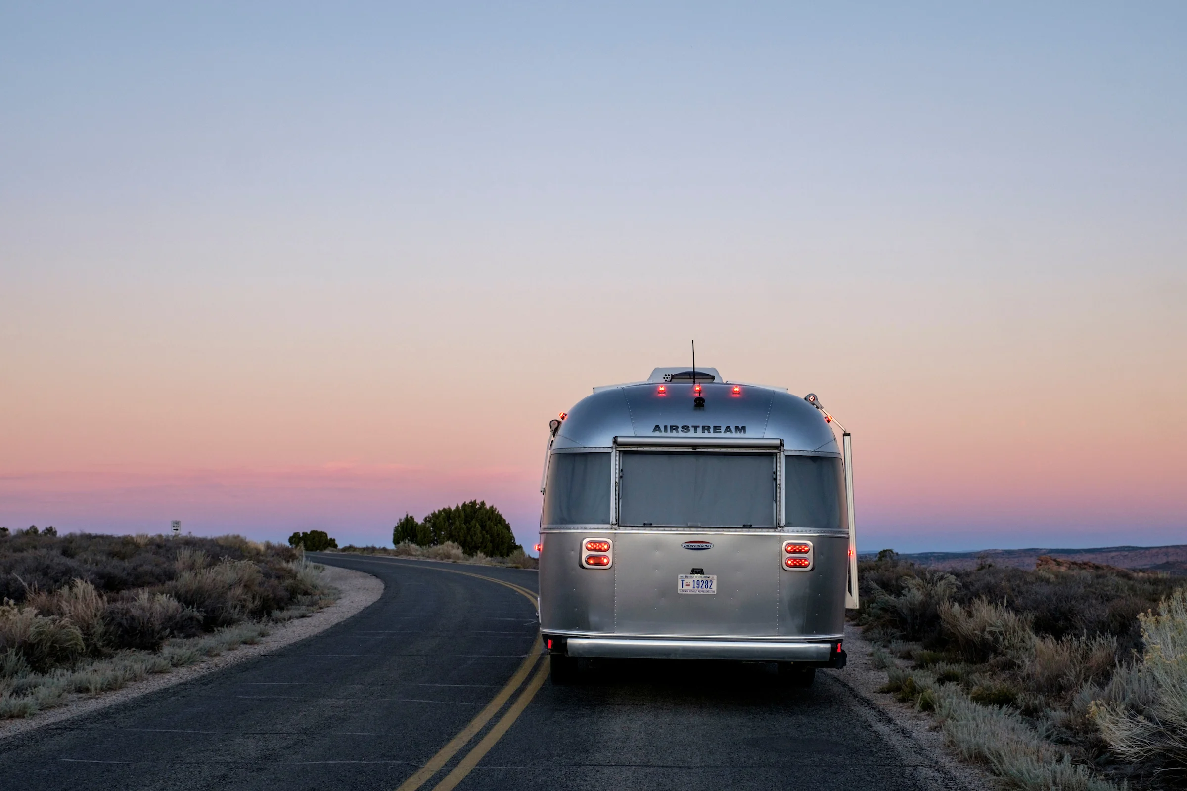 Wally the Airstream on the road in Arches National Park.
