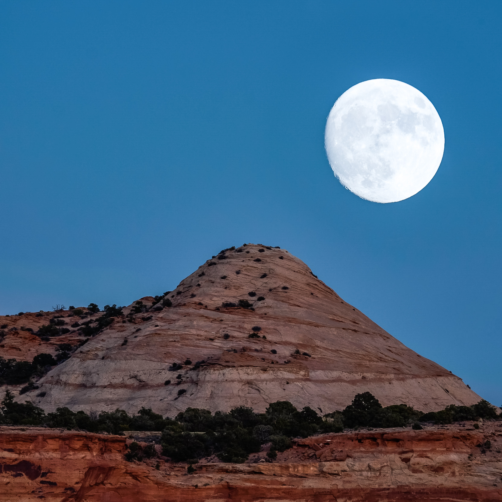 An in-camera double exposure shot of a supermoon rising over Canyonlands in November, 2016.