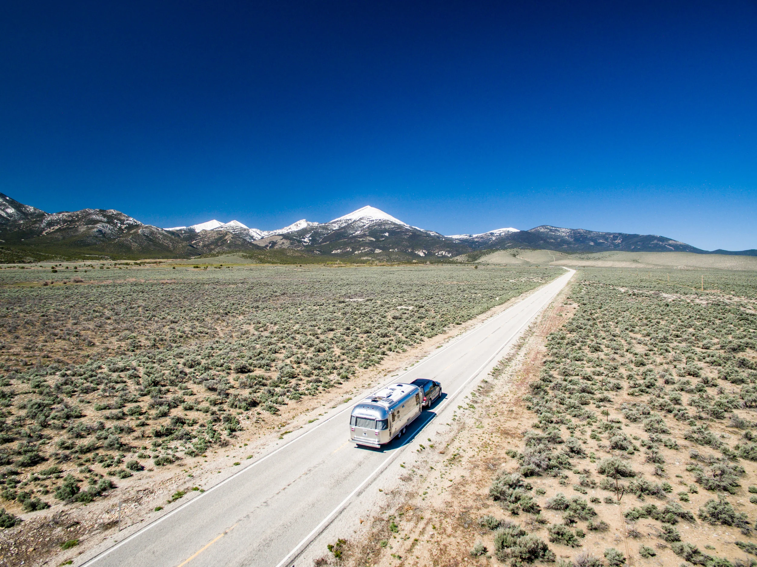 Wally the Airstream entering Great Basin National Park in Nevada. This drone shot was taken *outside* of the park boundaries and is perfectly legit. :)